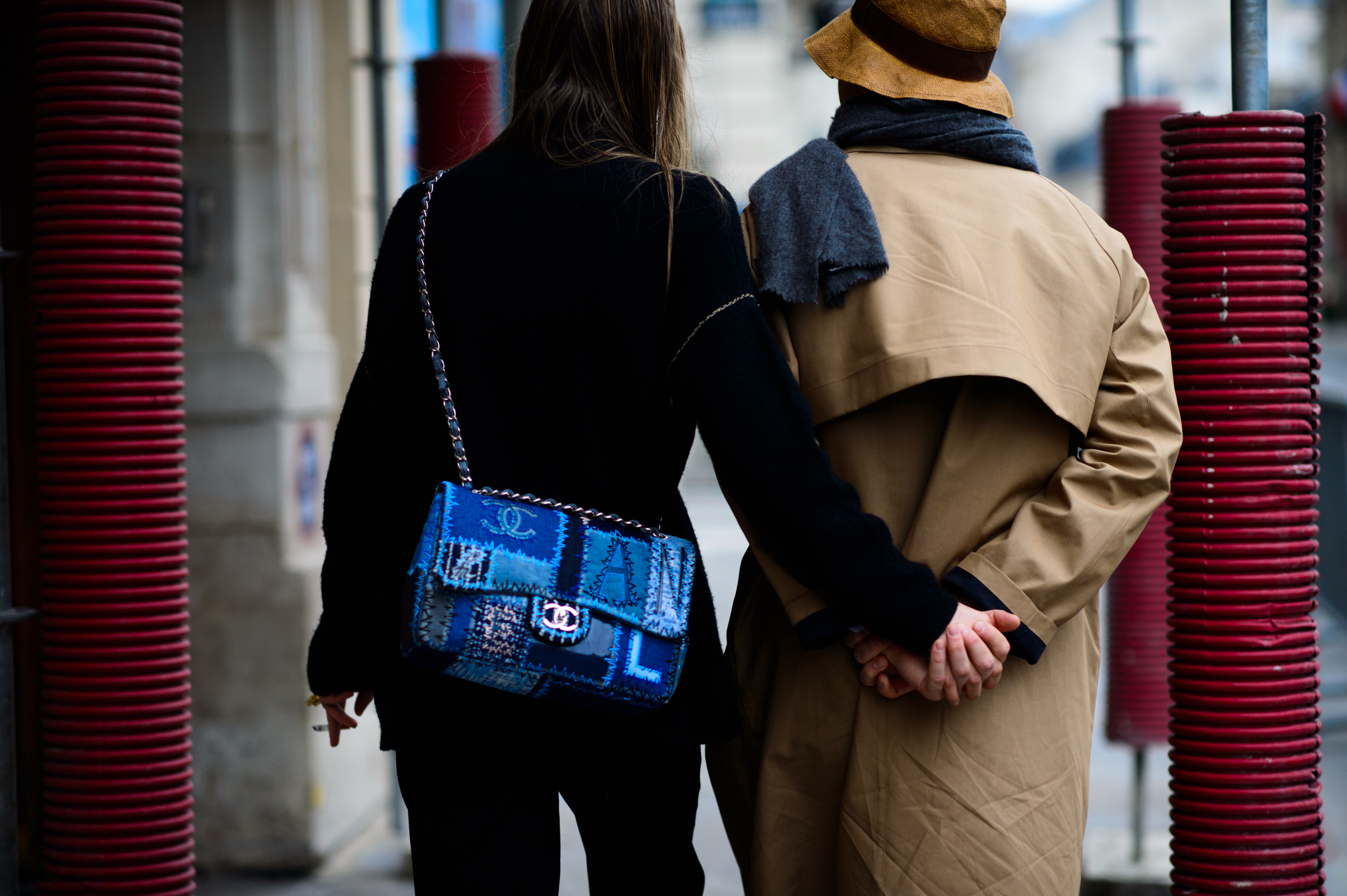 Couple holding hands on the street