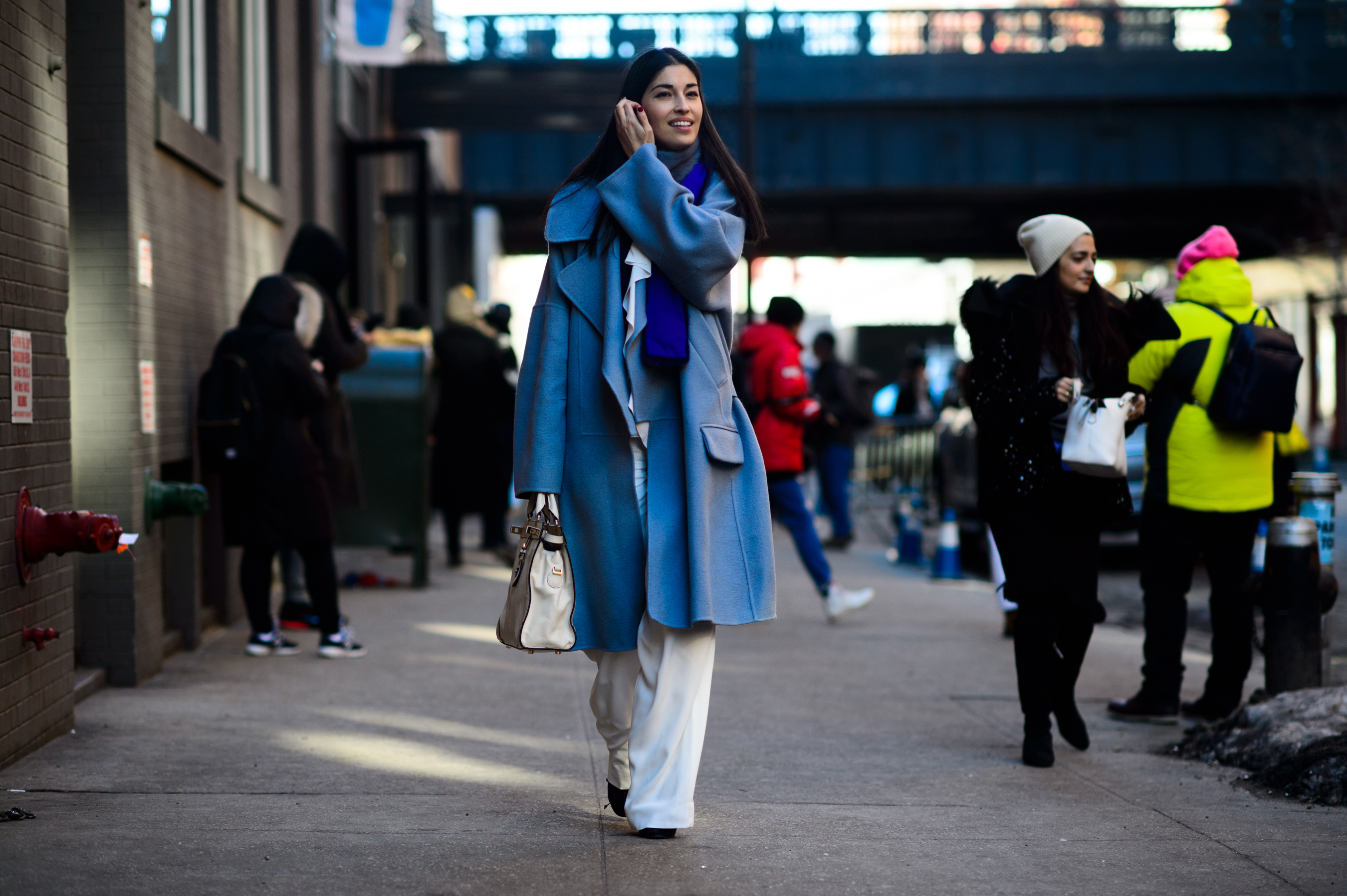 Tank magazine editor wearing blue coat
