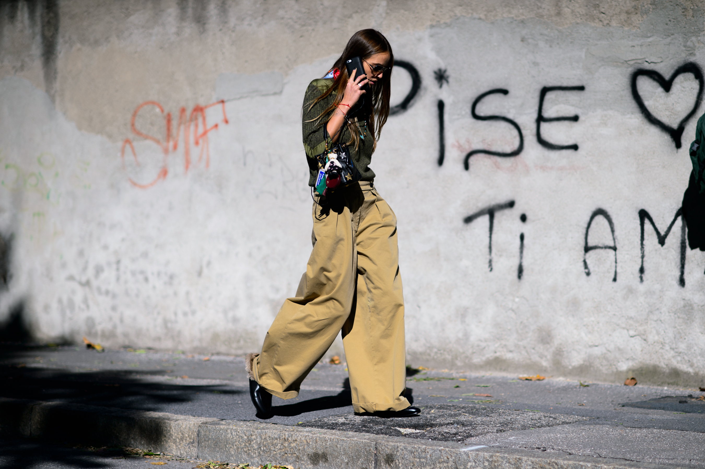 Italian woman wearing sand pants and khaki top