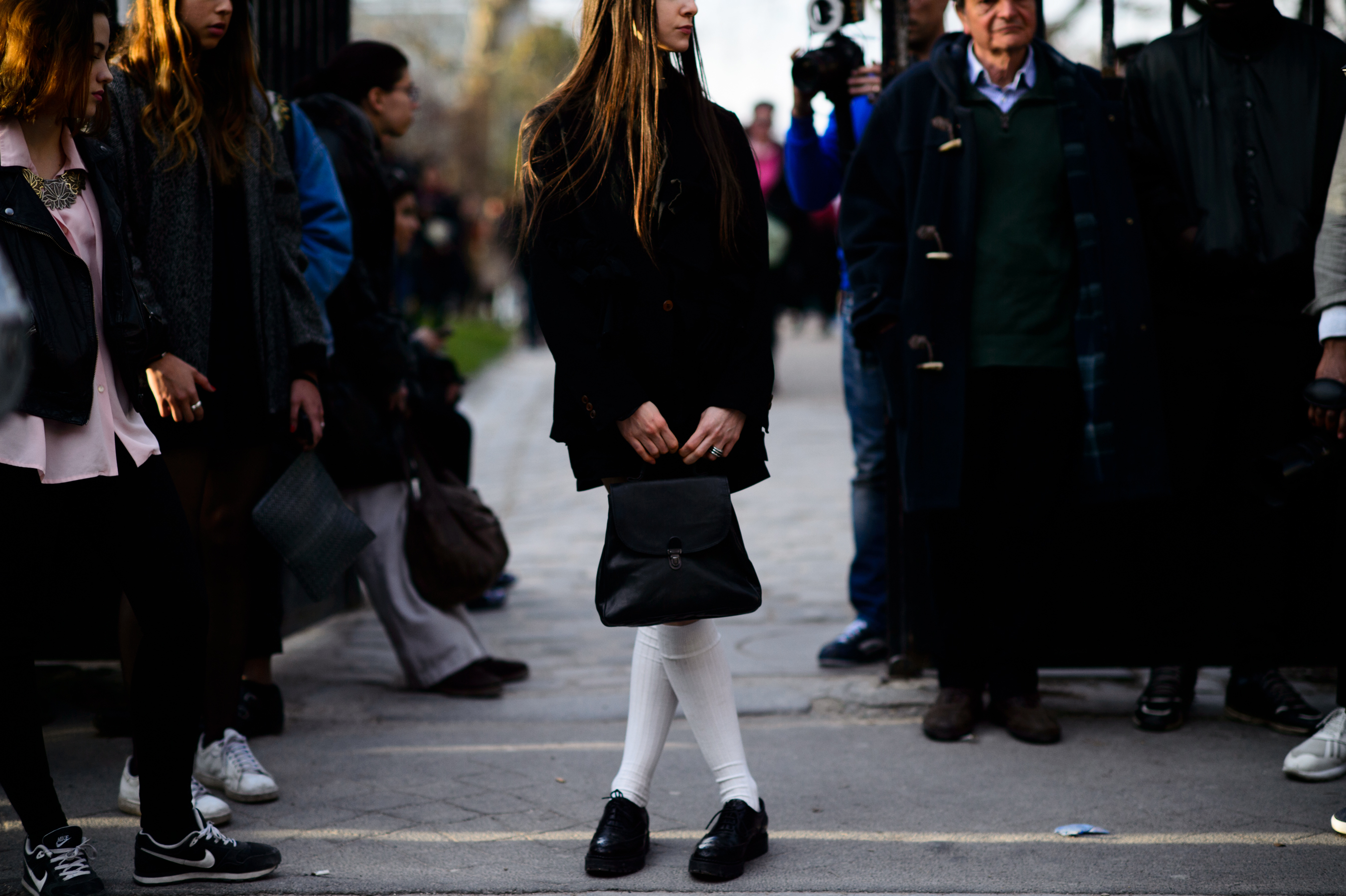Woman wearing high socks and vintage suit