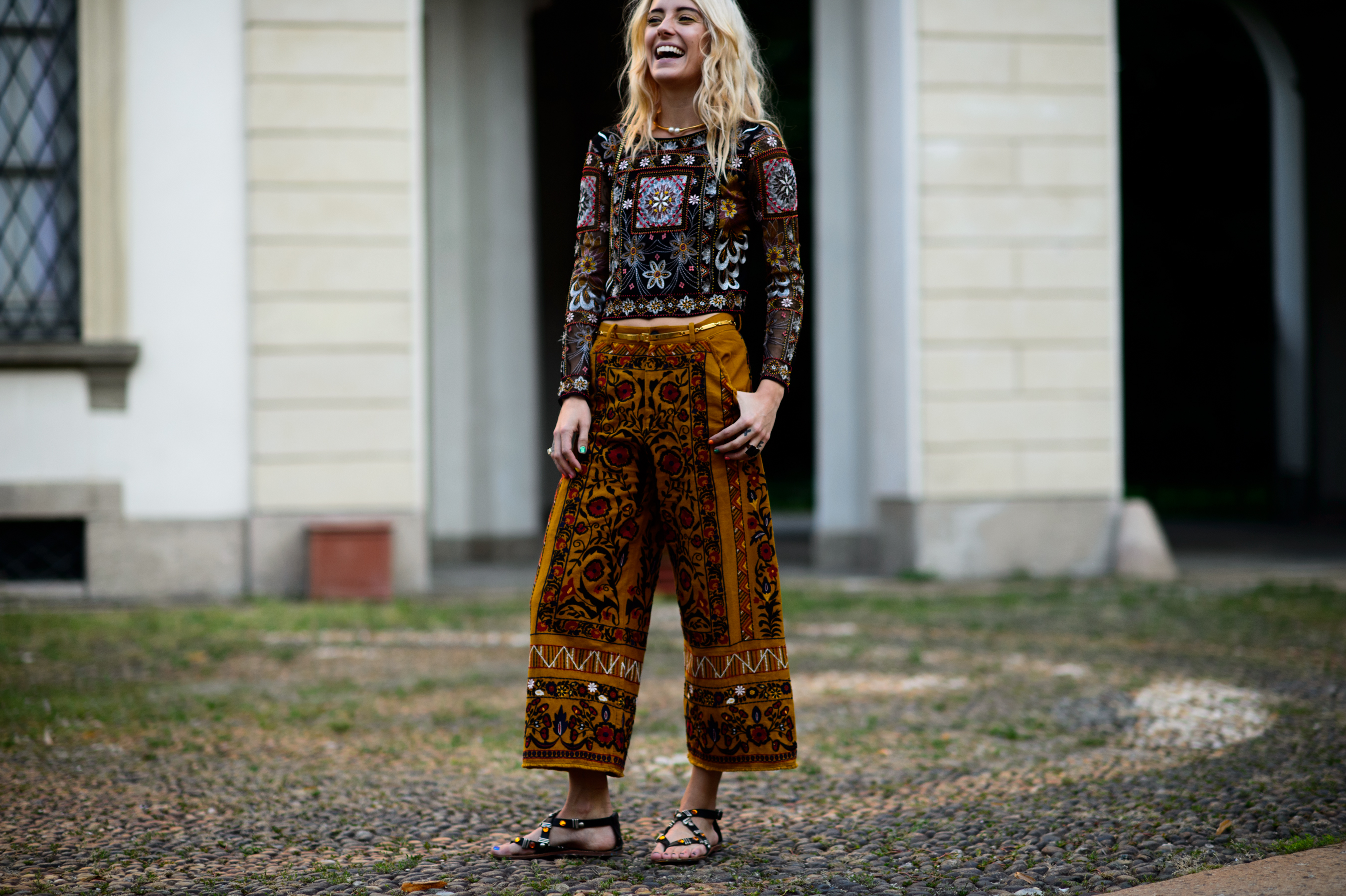 Blonde girl wearing tribal outfit with sandals