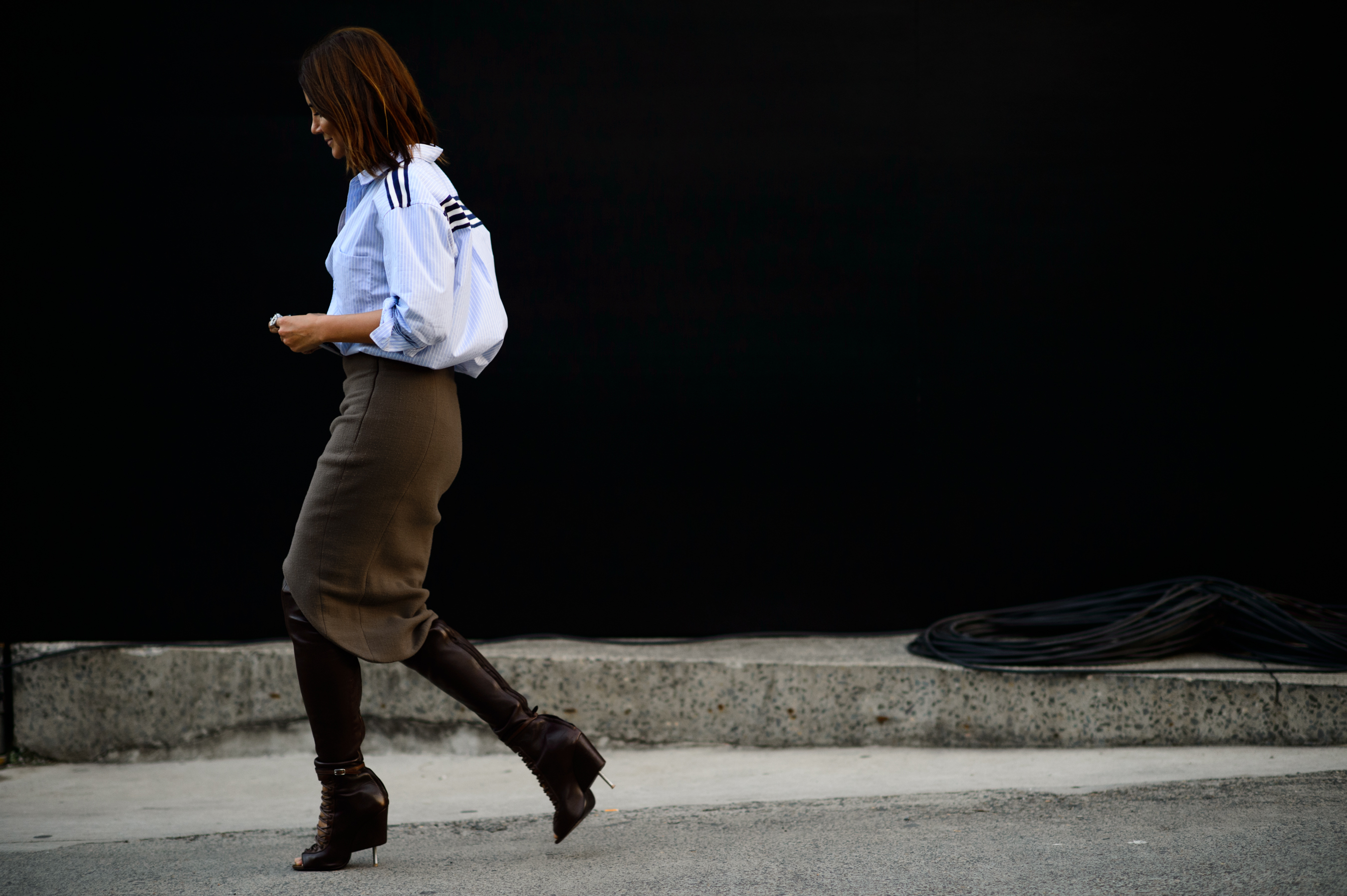 Vogue Australia editor wearing brown skirt and blue shirt