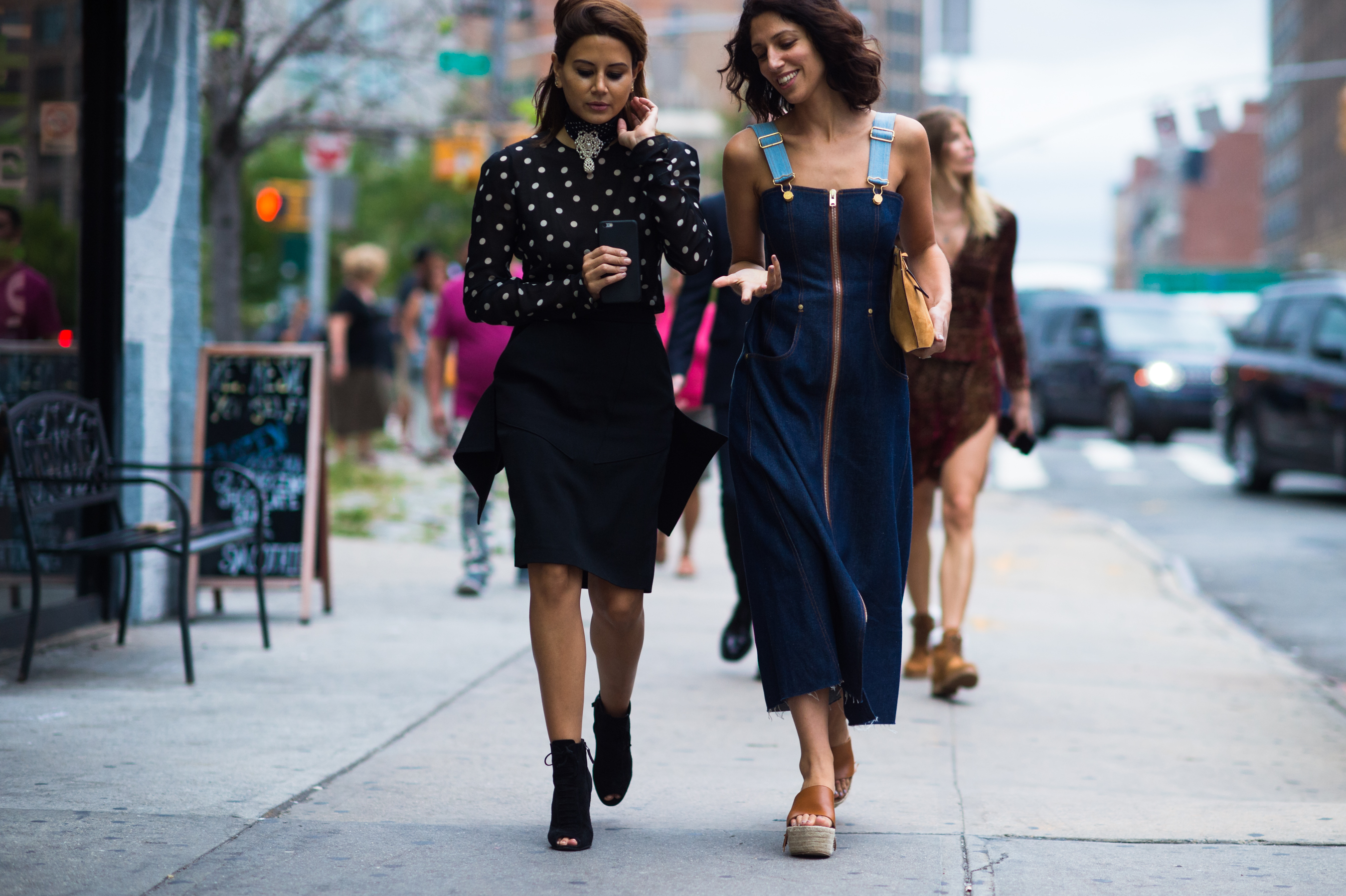 Two women walking down the street