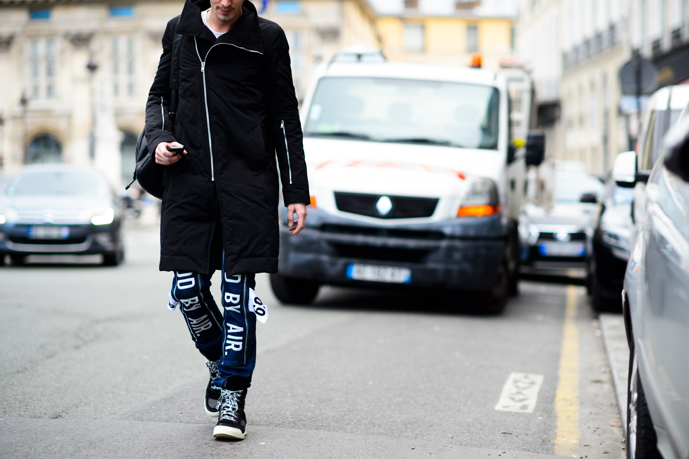 Man wearing coat and jeans