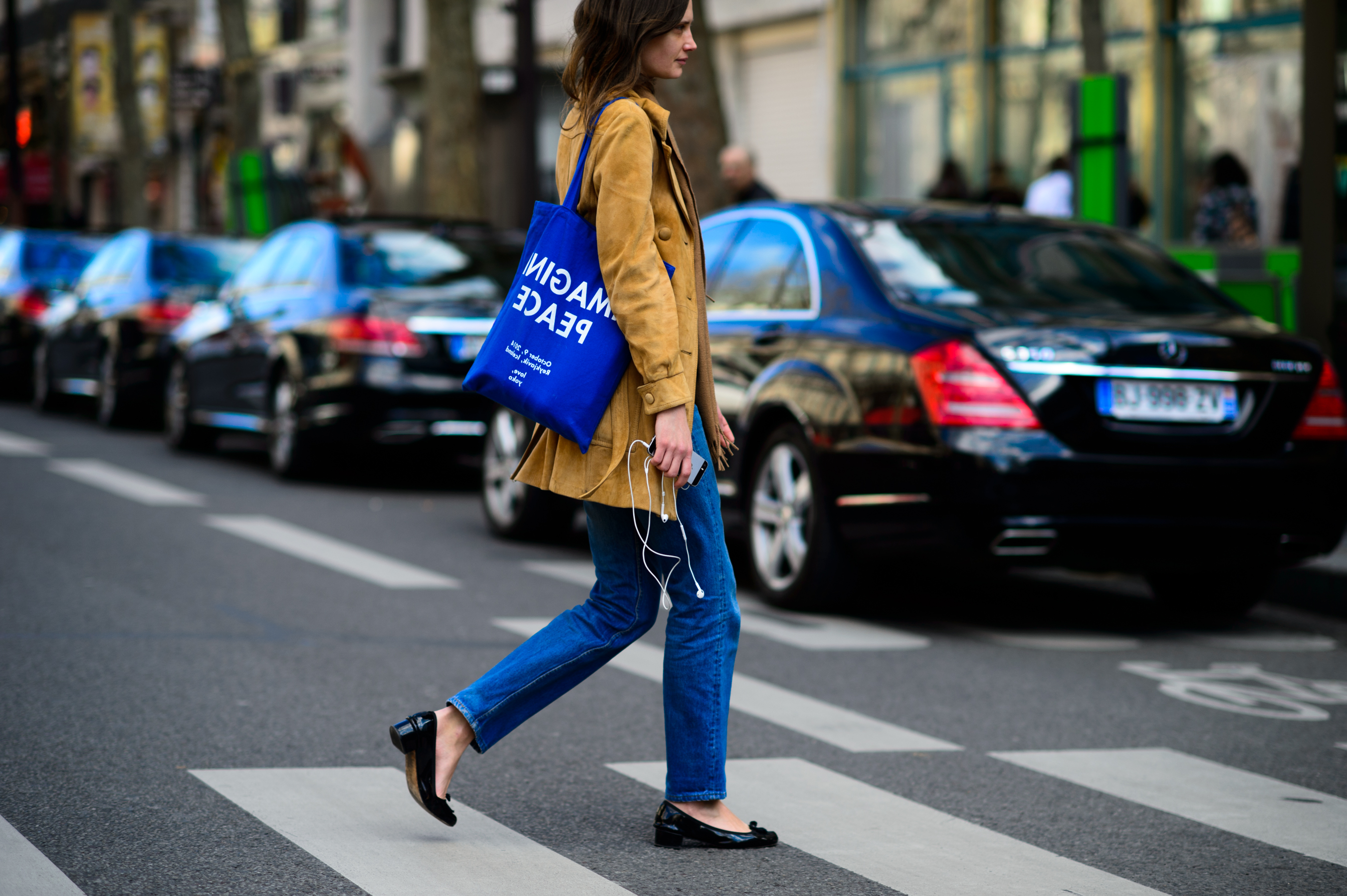 Woman wearing beige coat and jeans
