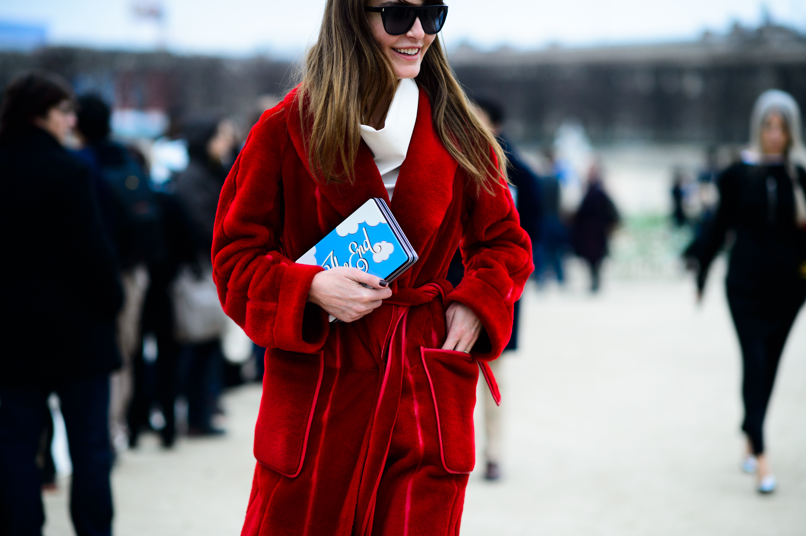 Turkish stylist wearing red coat