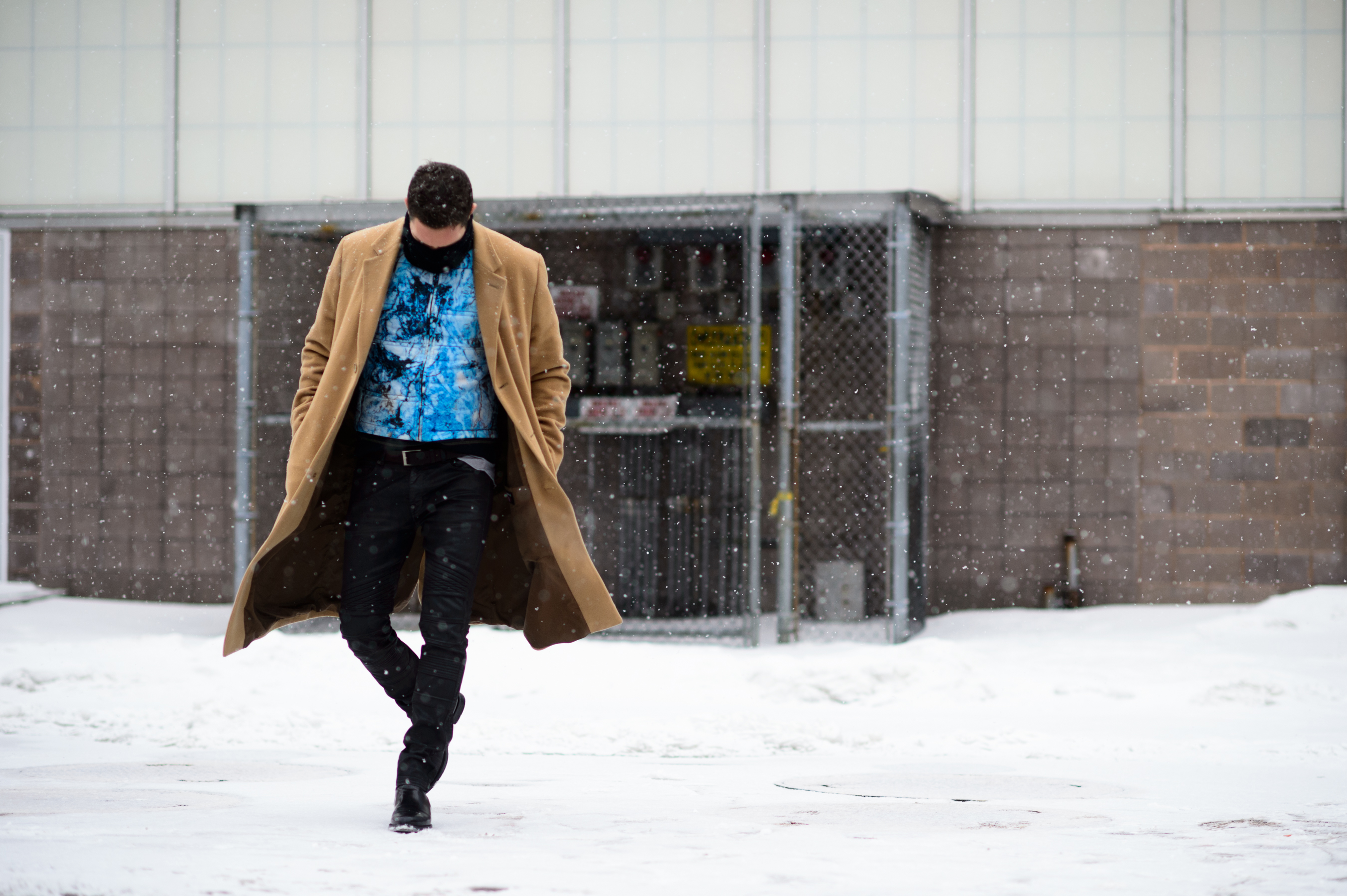 Man wearing long camel coat