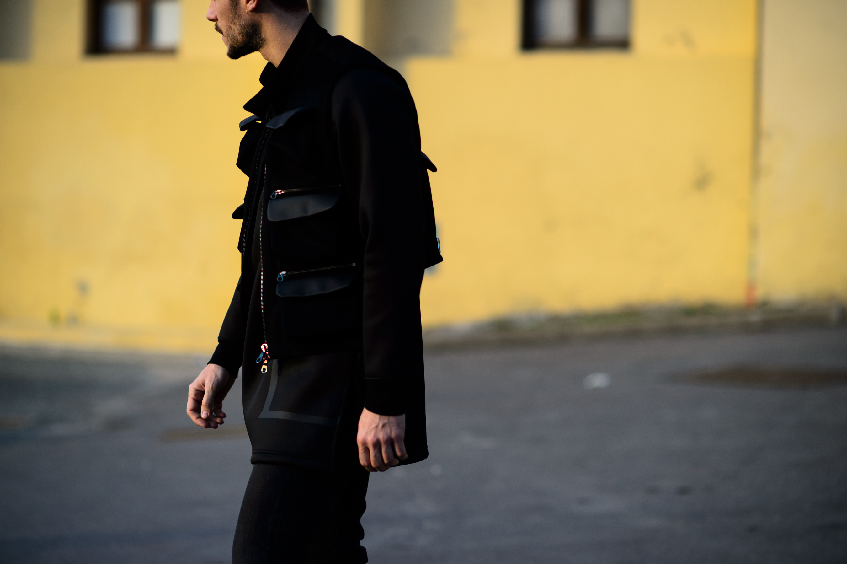 Man wearing jacket with multiple pocket