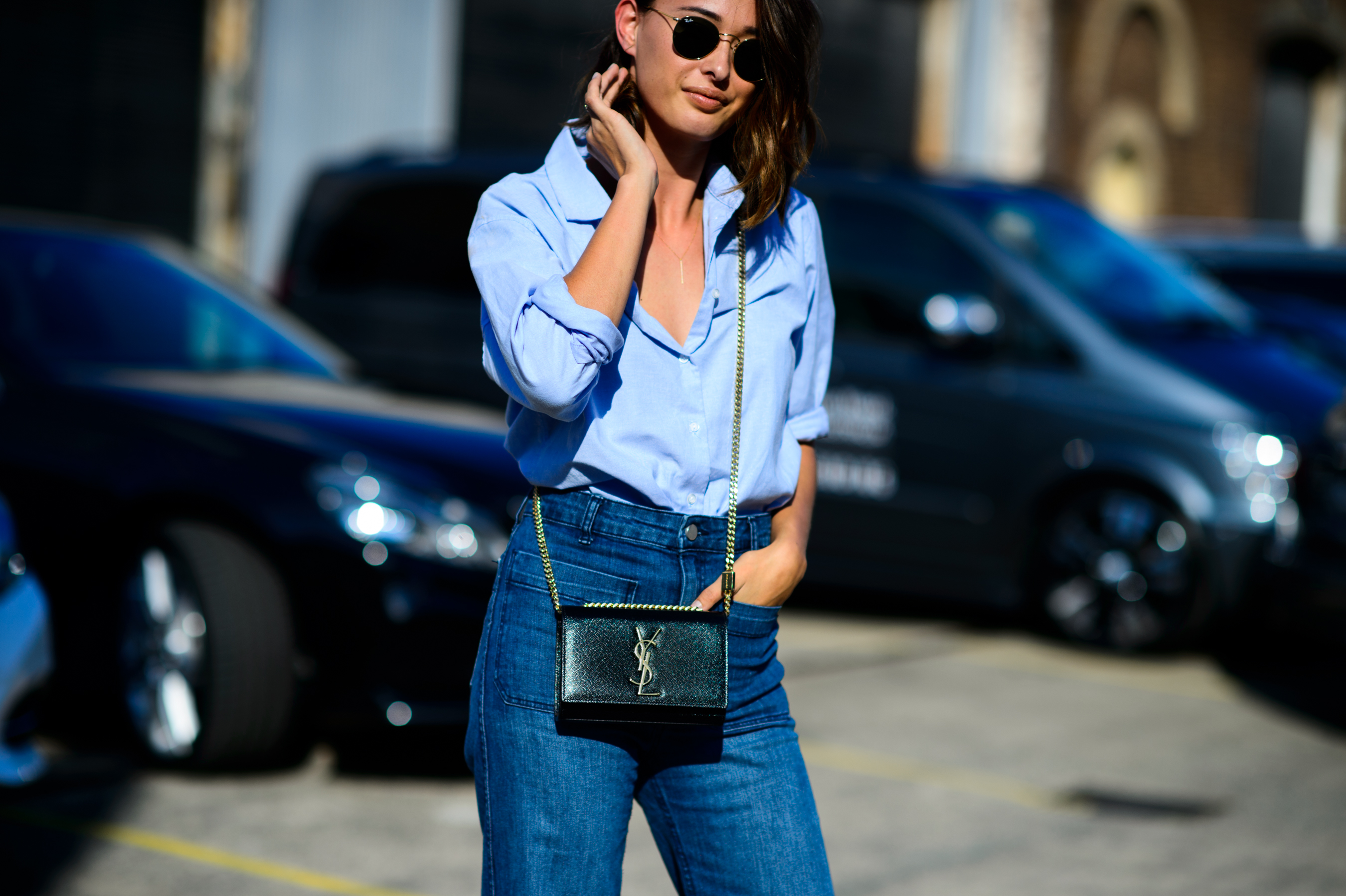 Woman wearing blue shirt and denim