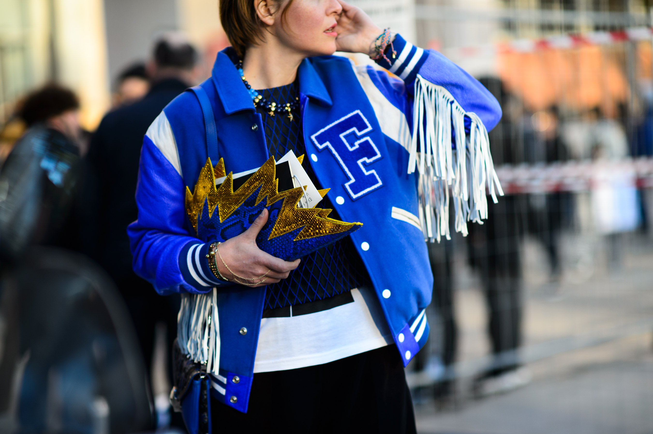 Woman in baseball jacket
