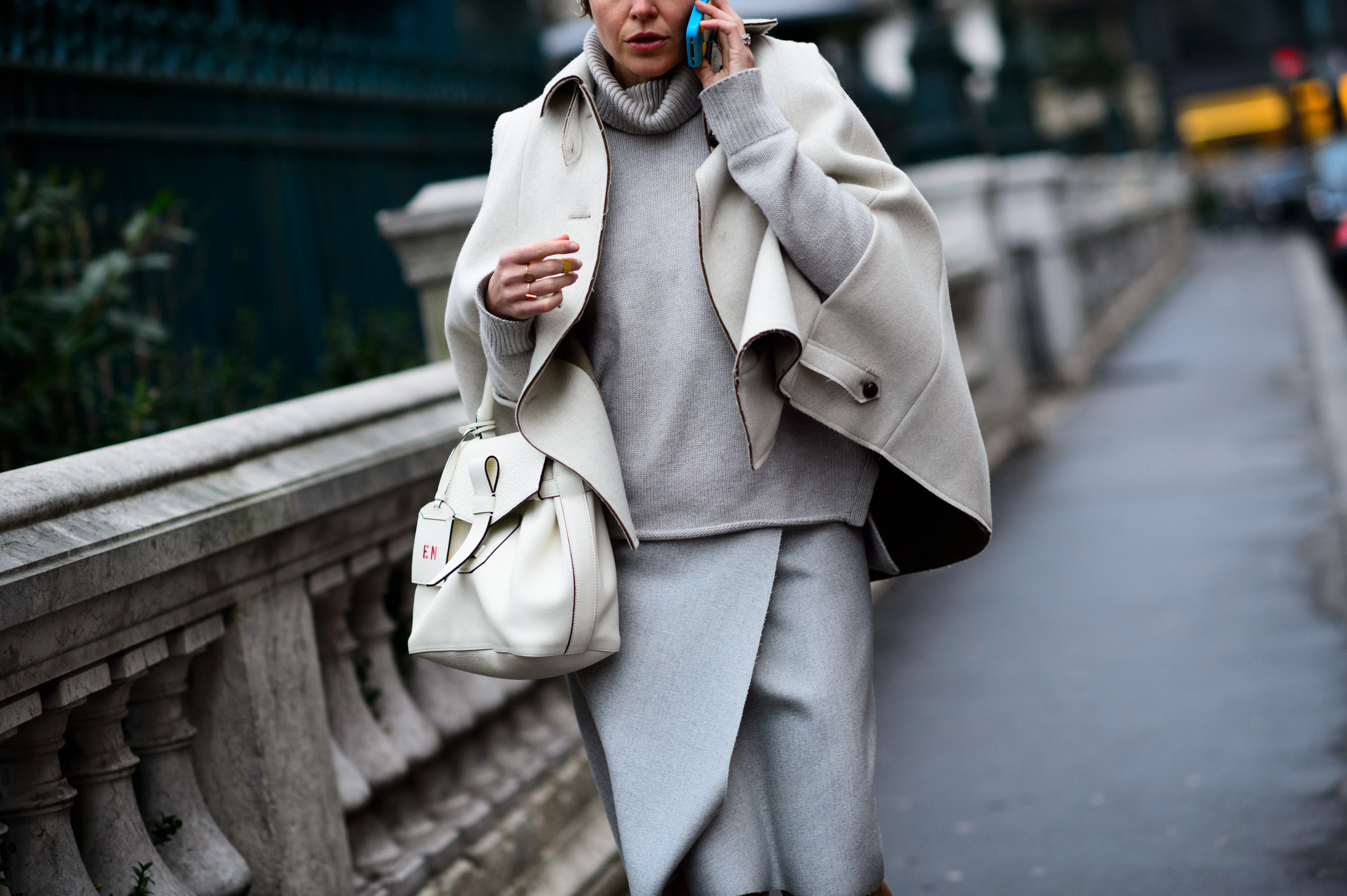 Woman wearing white cape before the show