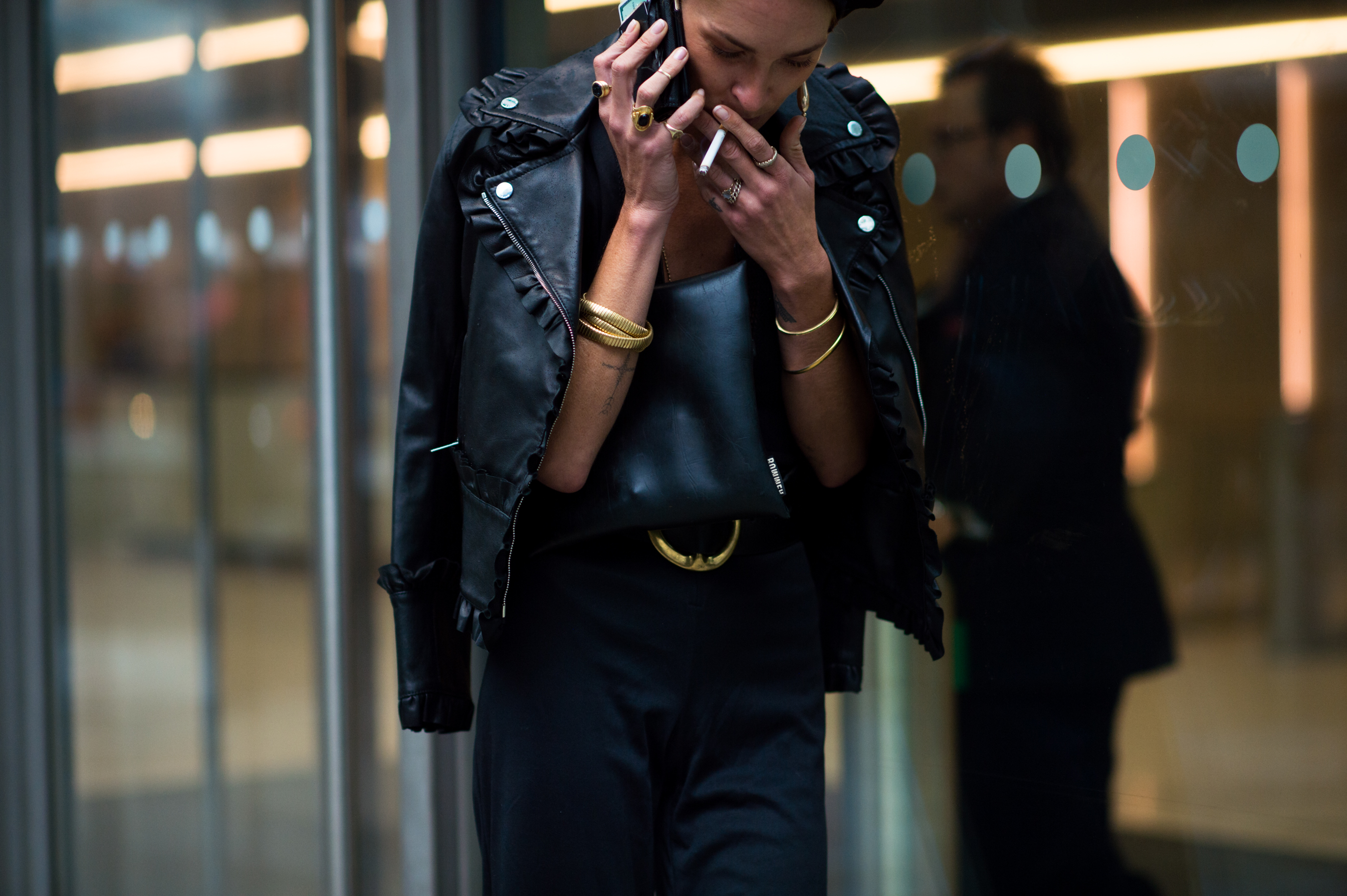 Woman wearing jewellery and leather jacket