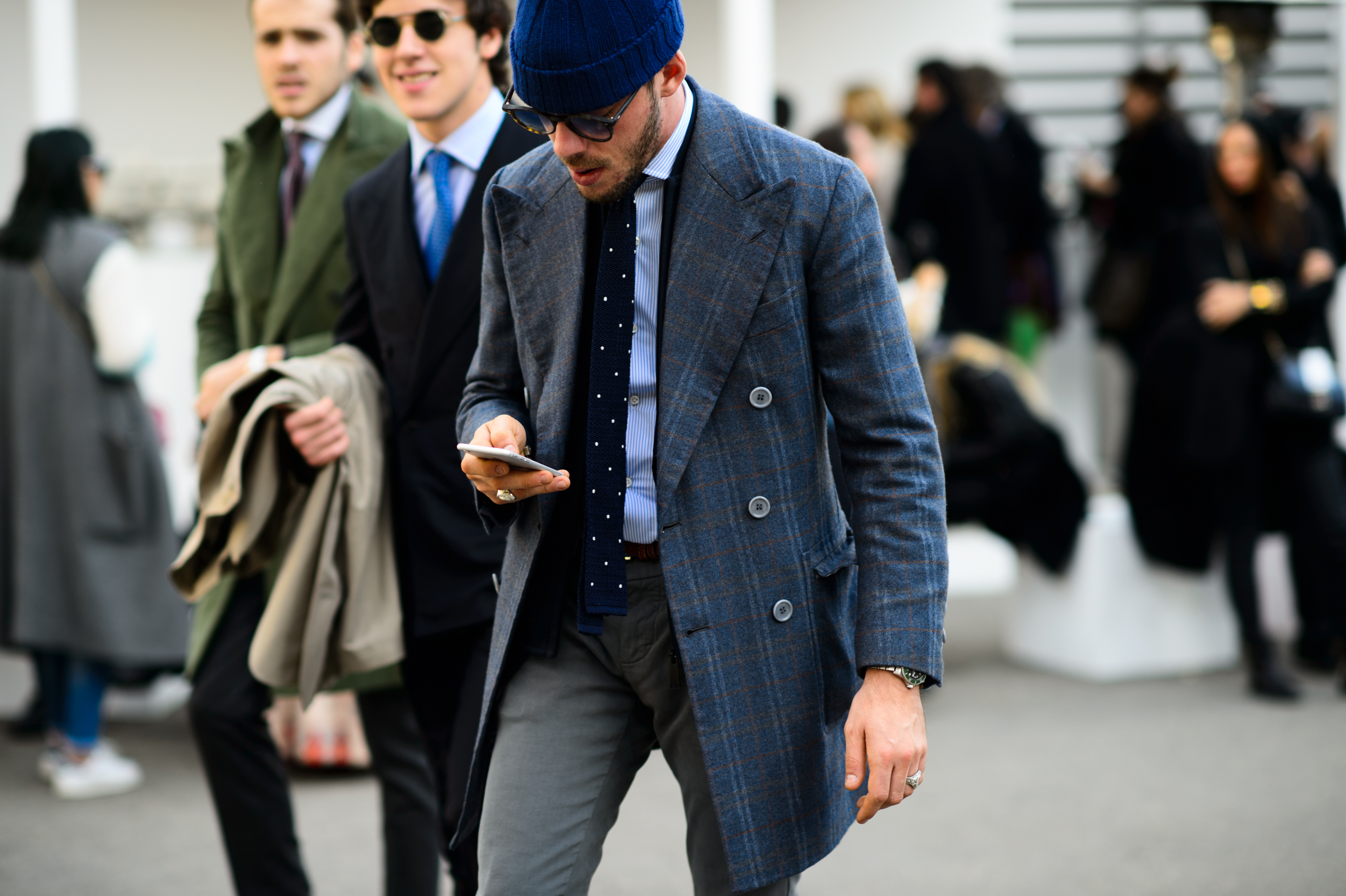 Man wearing blazer and hat