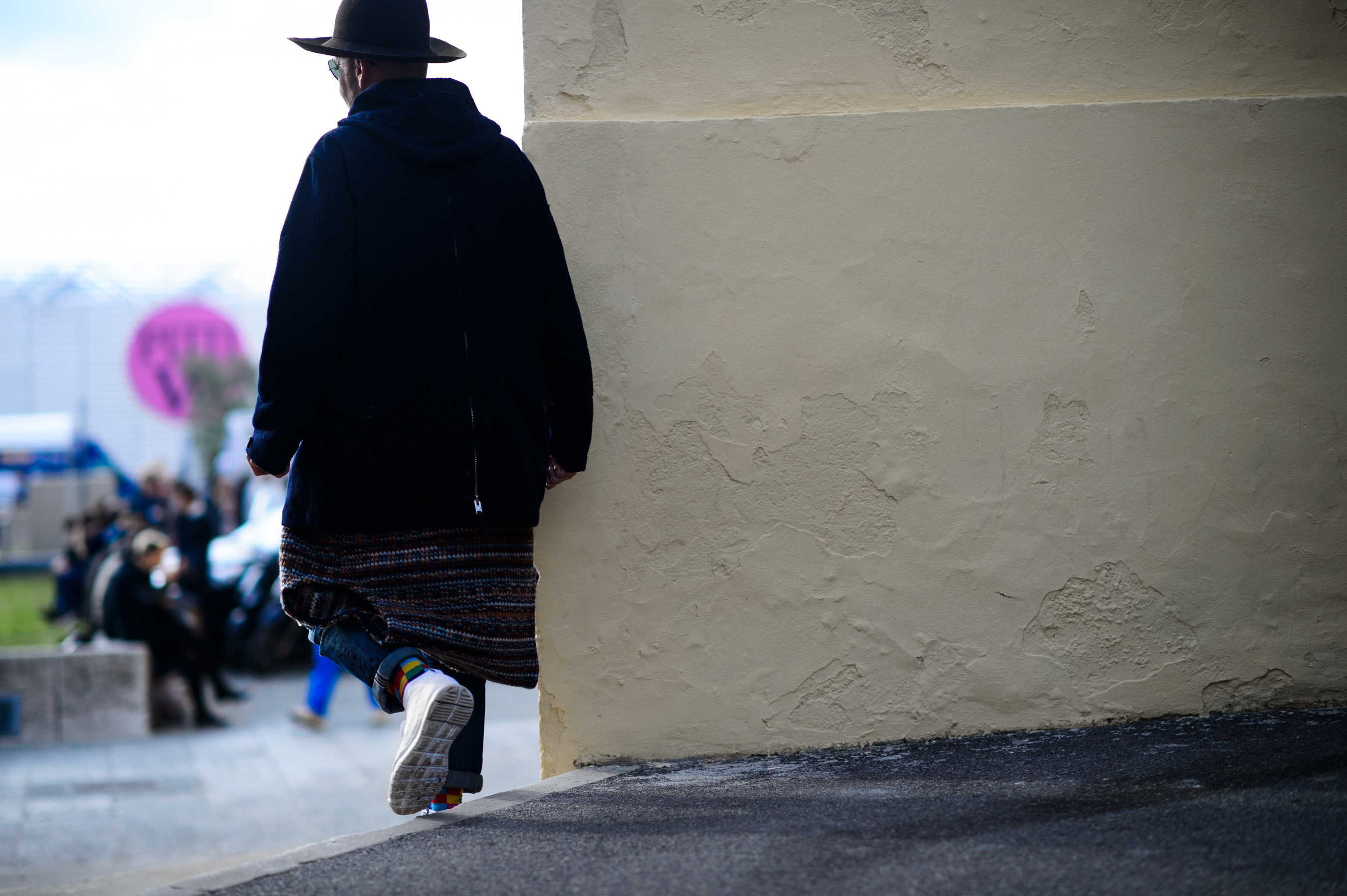 Man wearing hat and long sweater