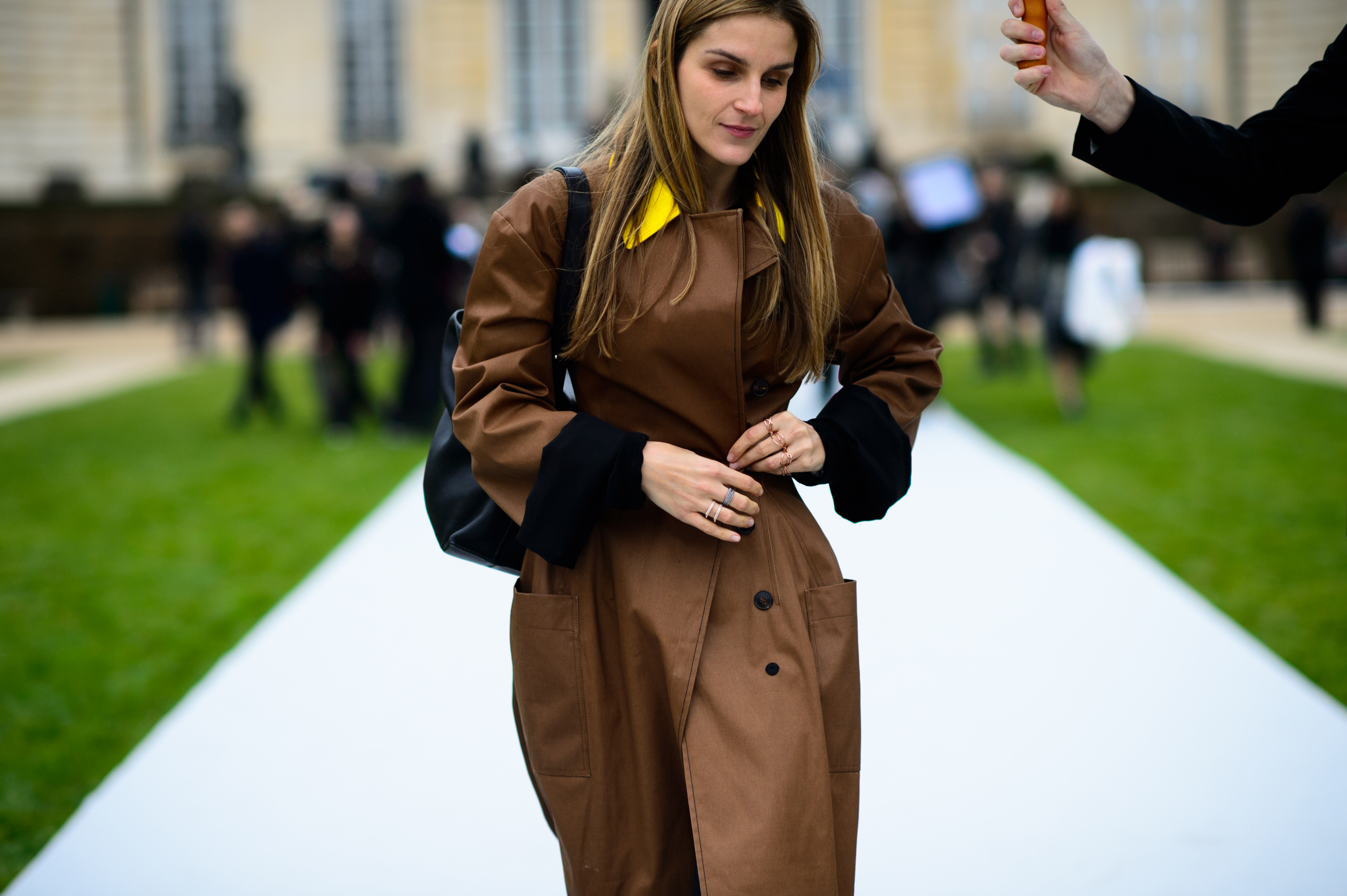Jewellery designer wearing pre-fall collection Dior coat