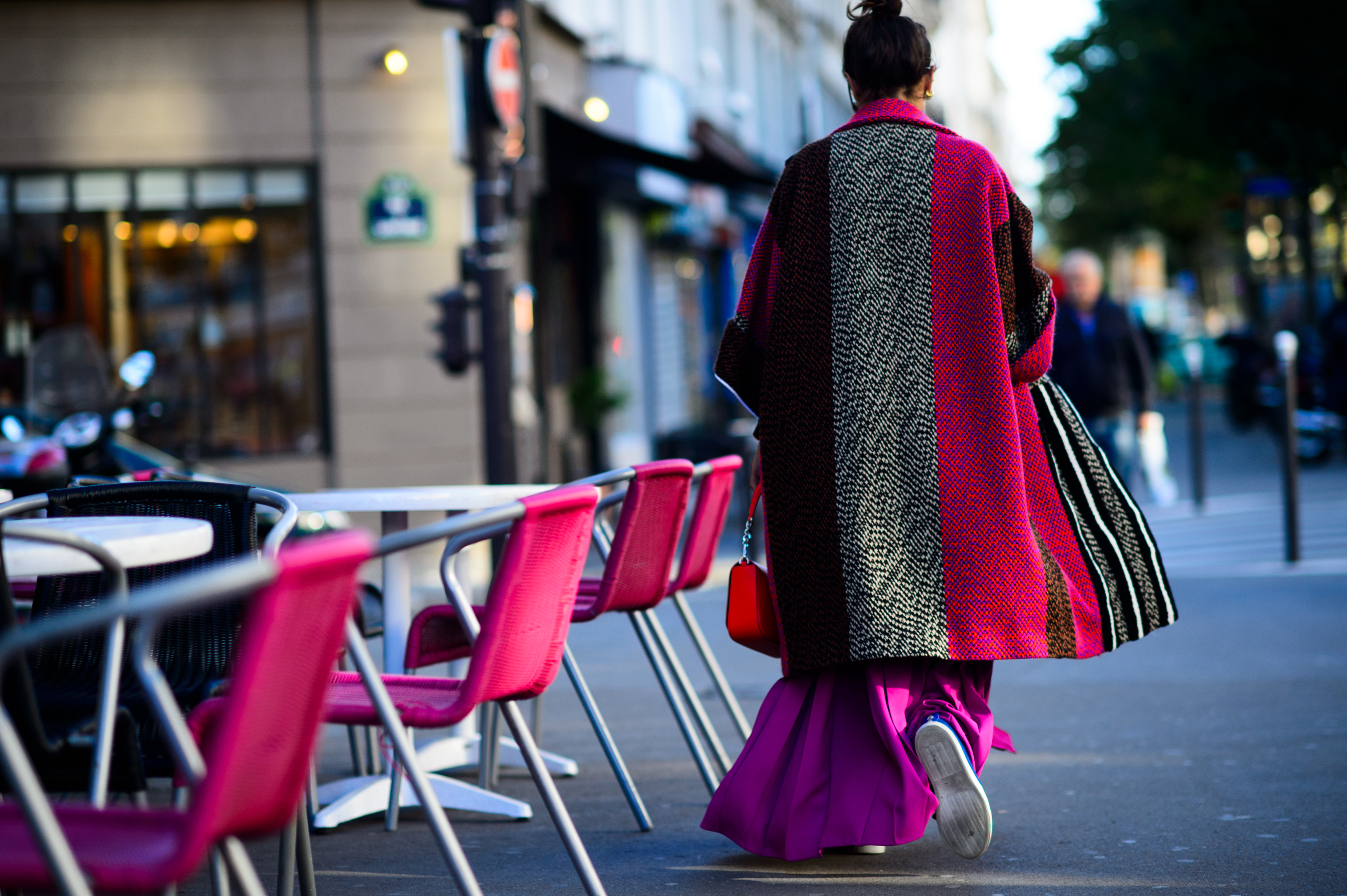 Woman in pink and purple outfit