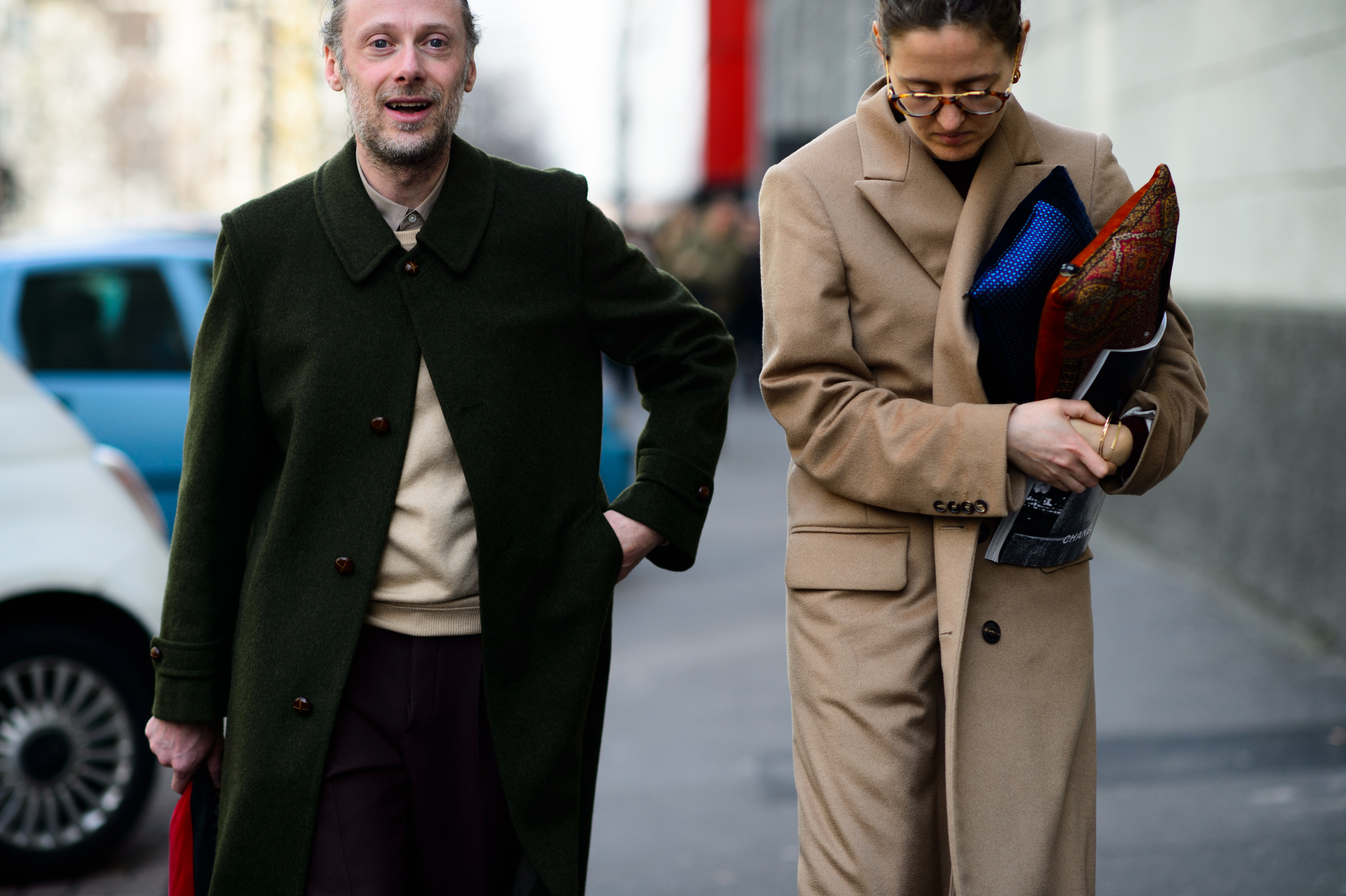 Editor and stylist holding Etro pillows after the show