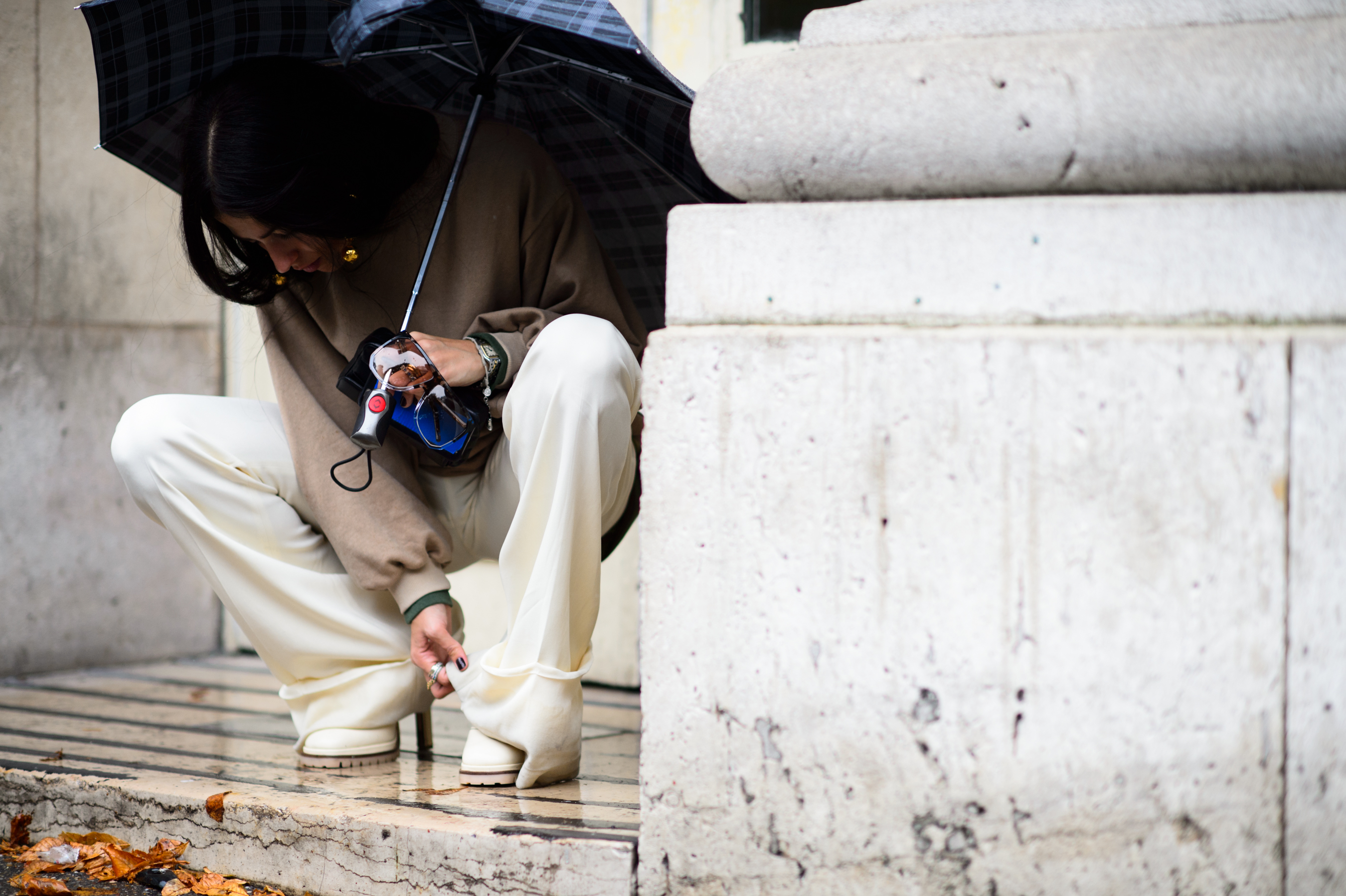 Italian woman fixing her pants
