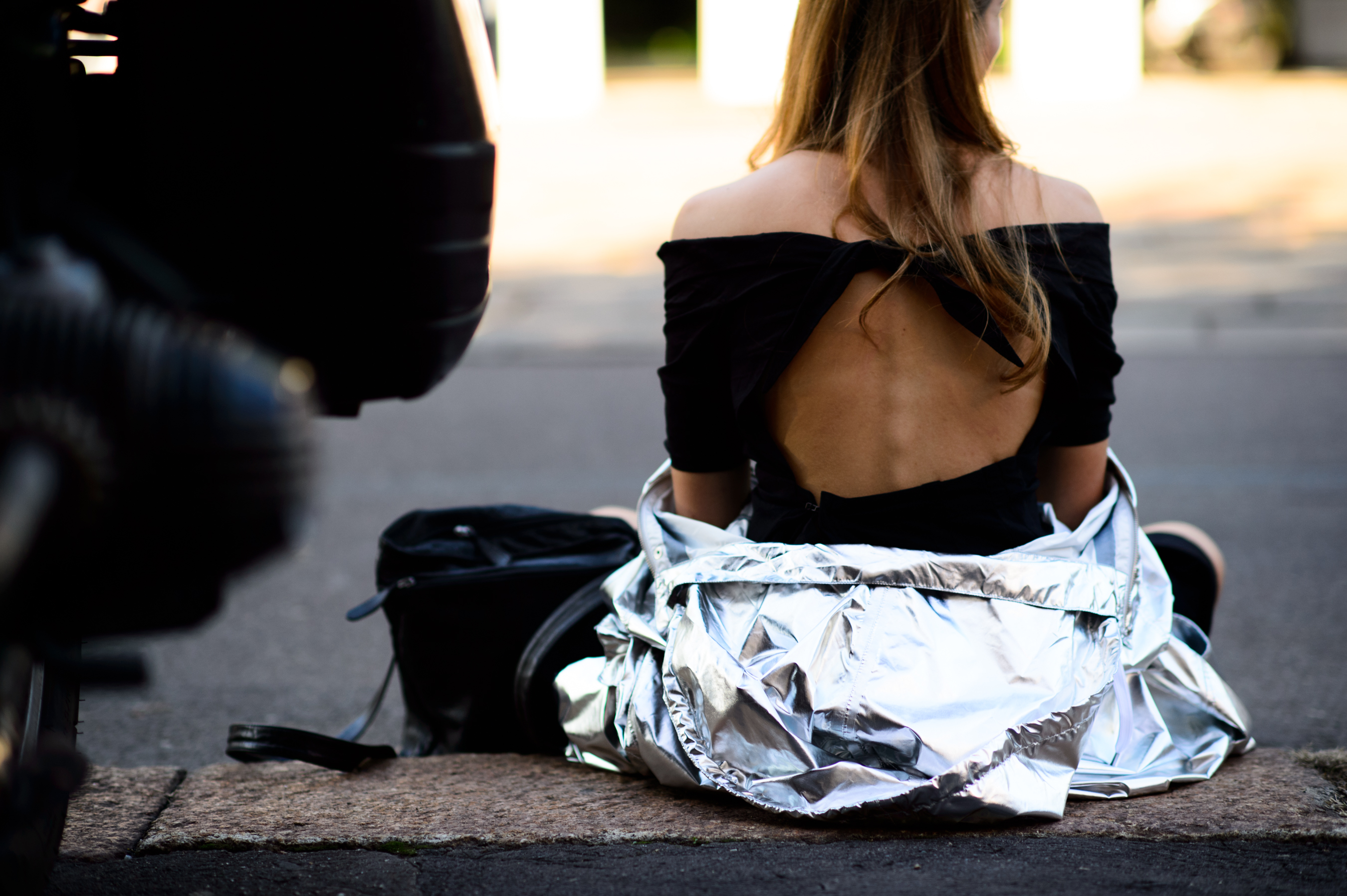 Italian girl wearing silver jacket