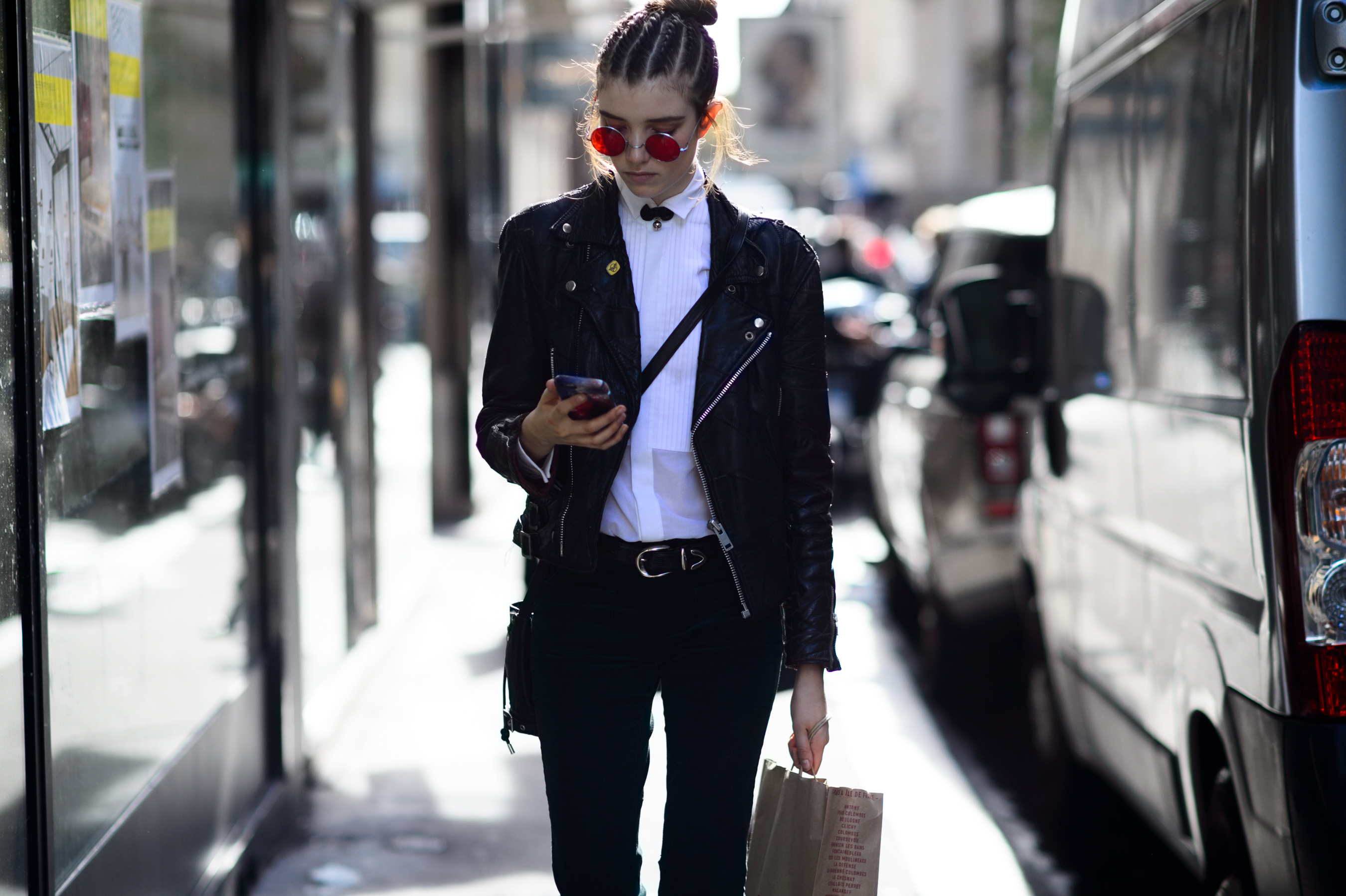 Model wearing red glasses after the show