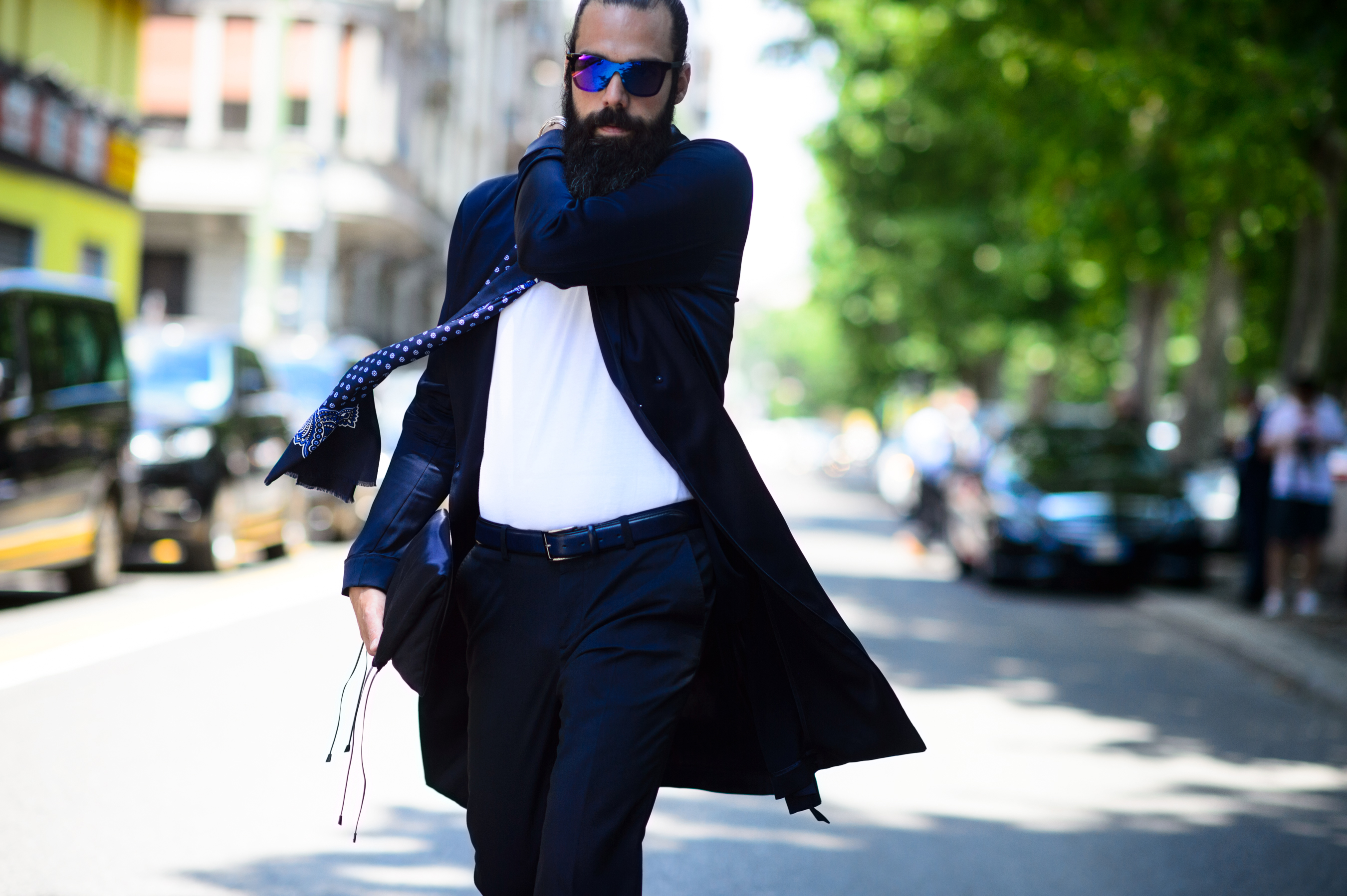 Italian man wearing scarf and glasses before the show