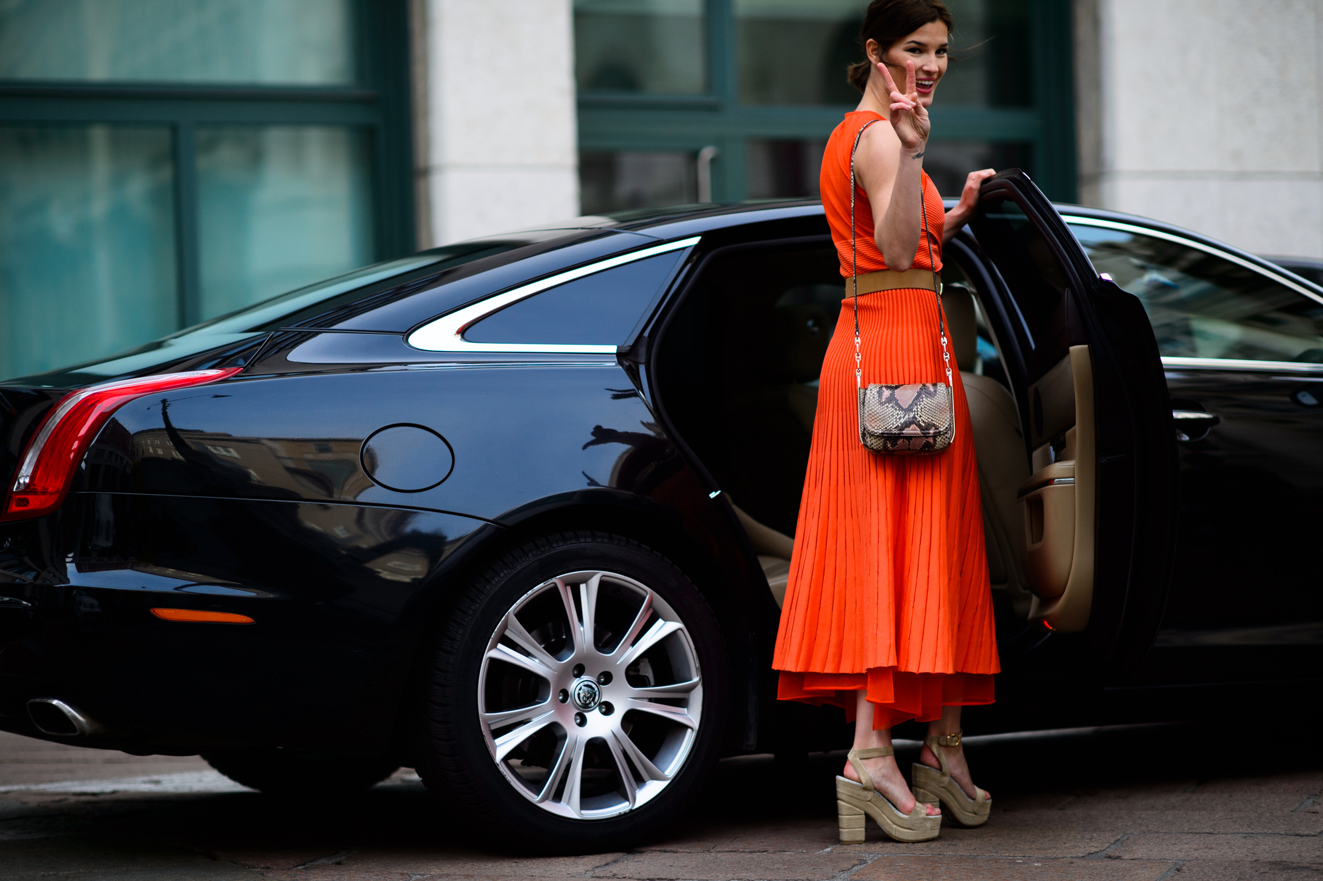 Woman in orange dress and sandals