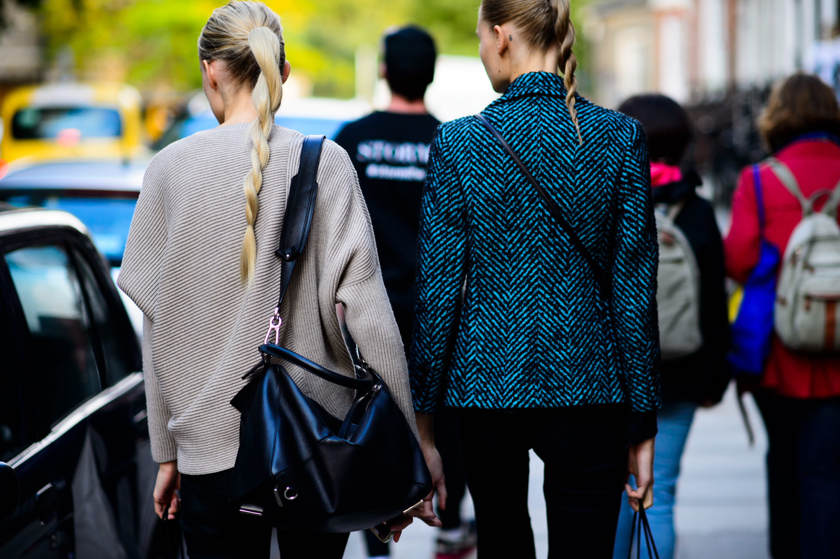 Two models with braided hair after the show