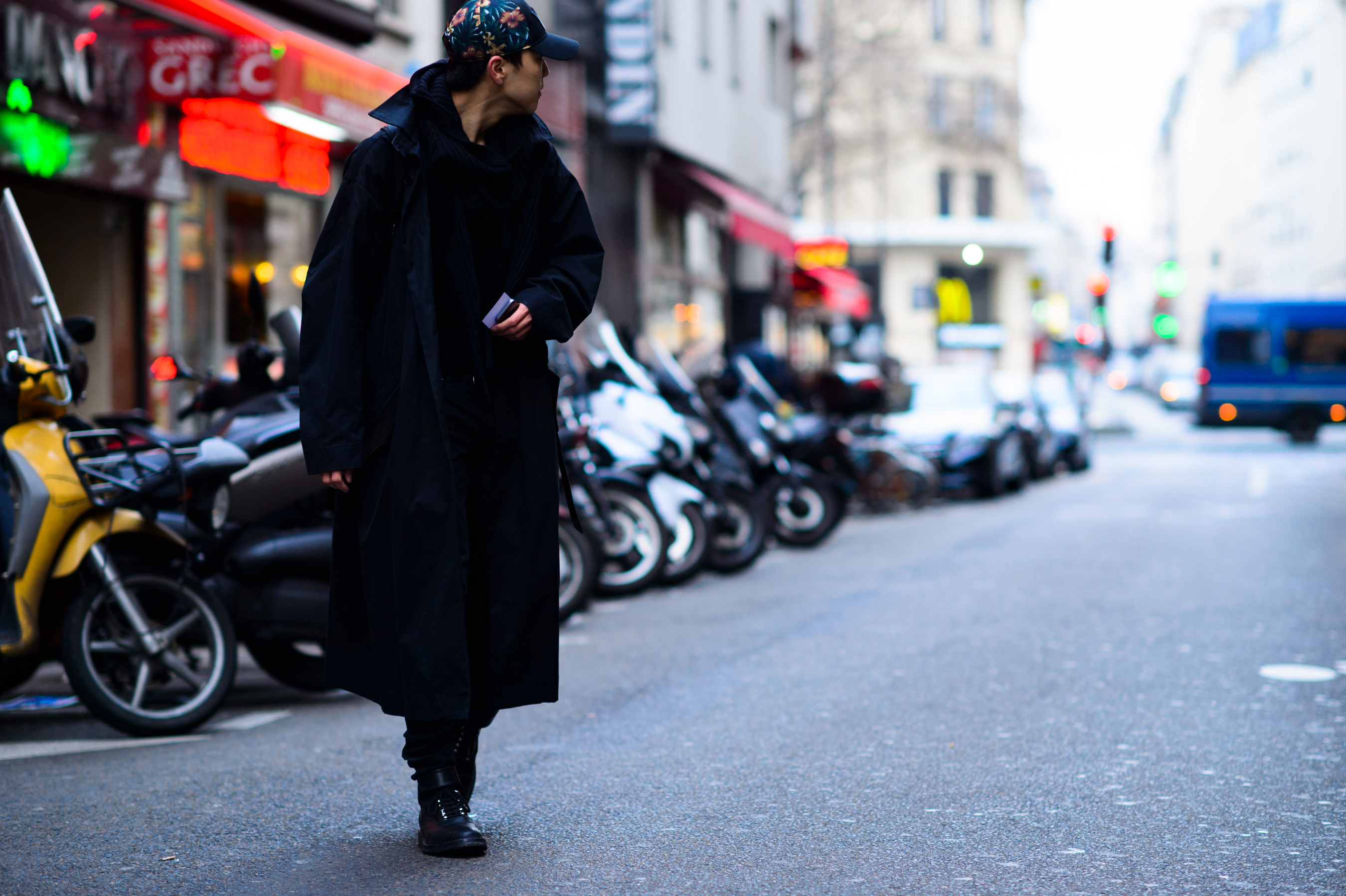 Asian man wearing black coat
