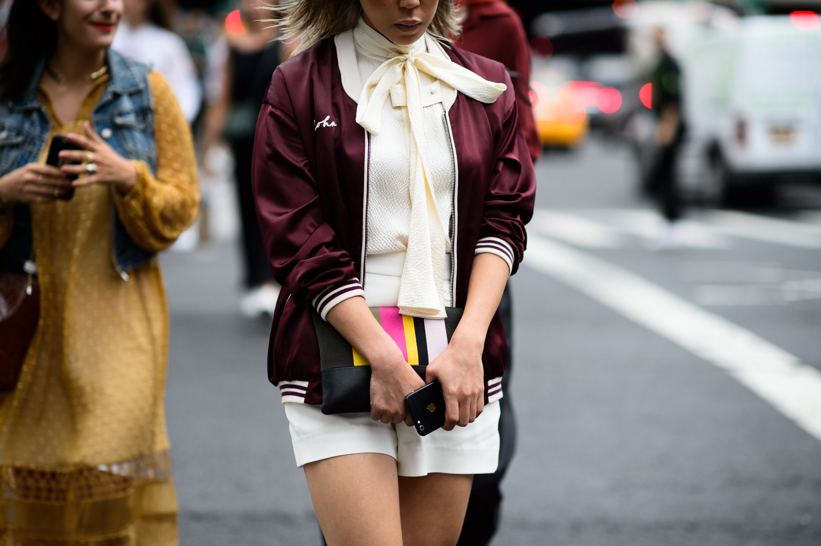 Woman wearing shirt with a loose bow tie after the show
