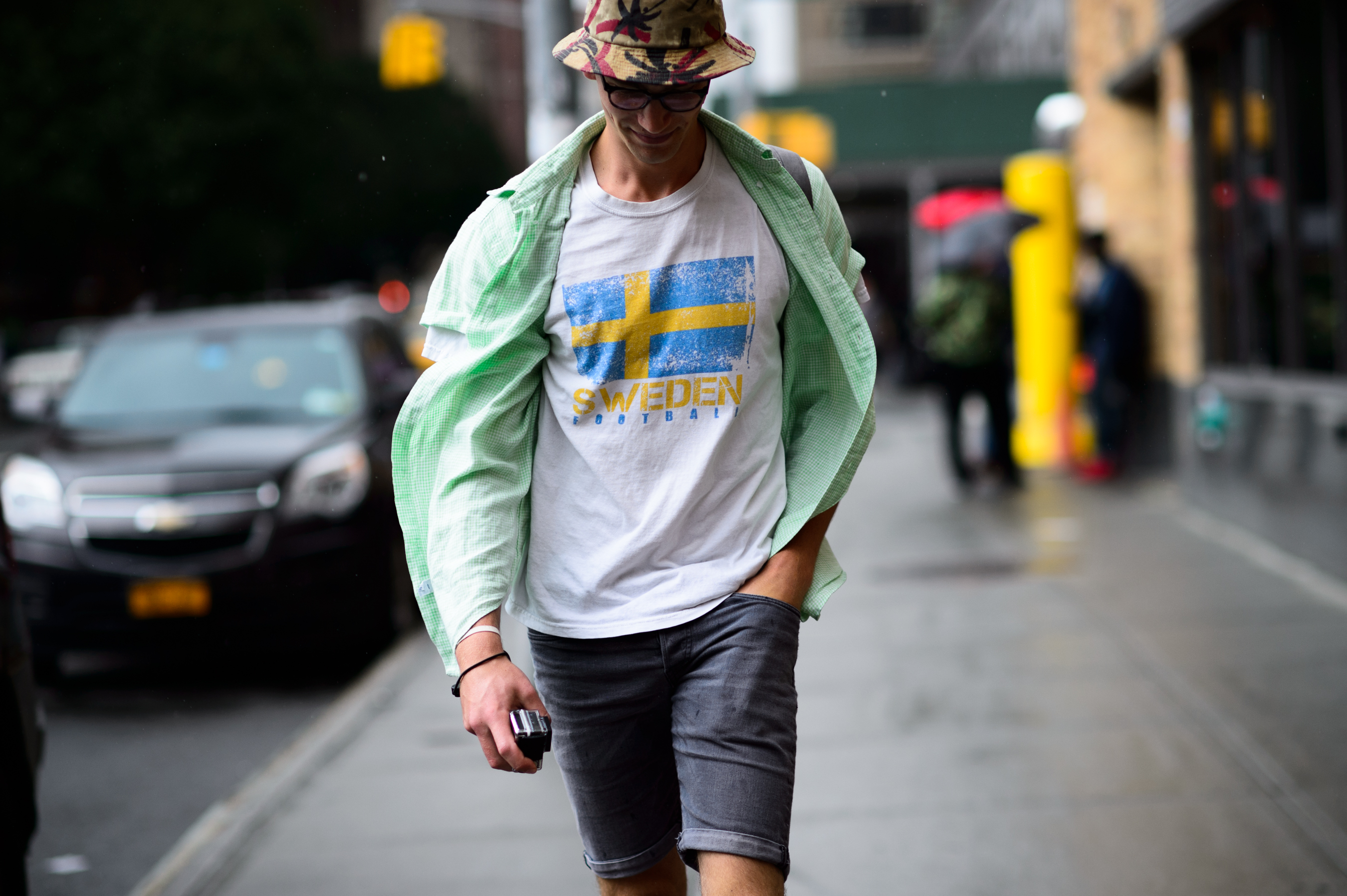 Man wearing Sweden football t-shirt and a bucket hat