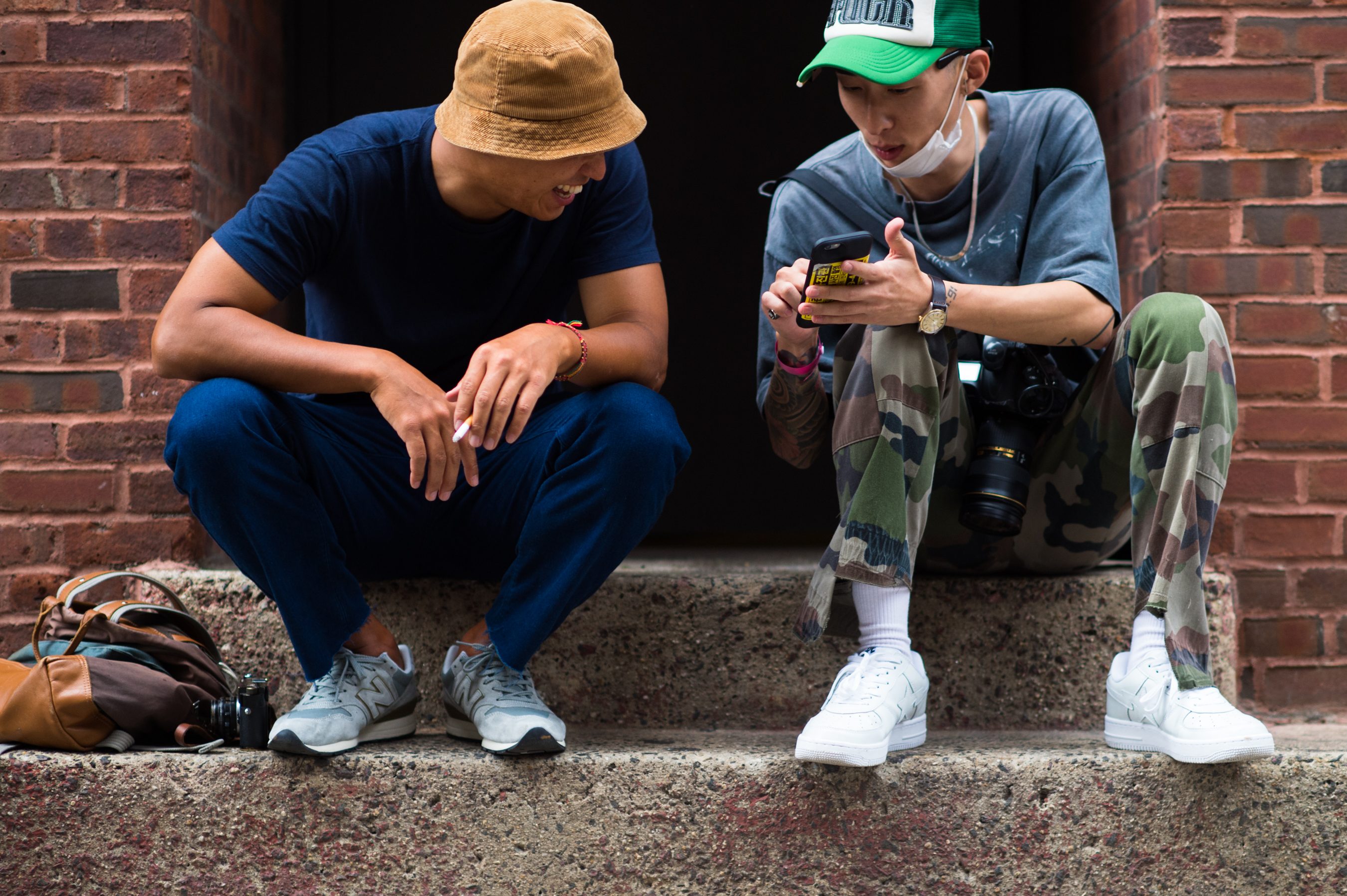 Two photographers sitting on the stairs
