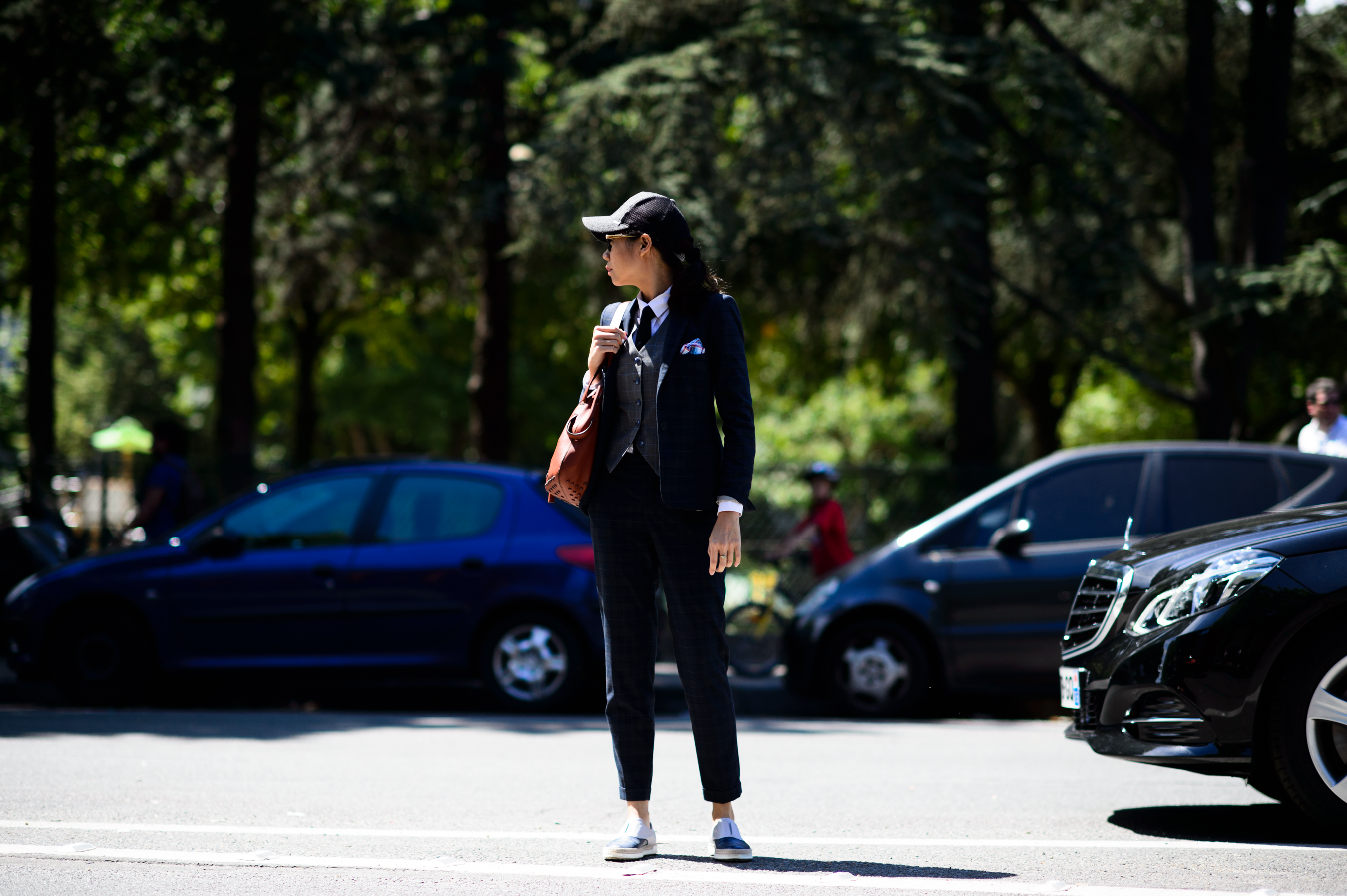Woman wearing suit with hat