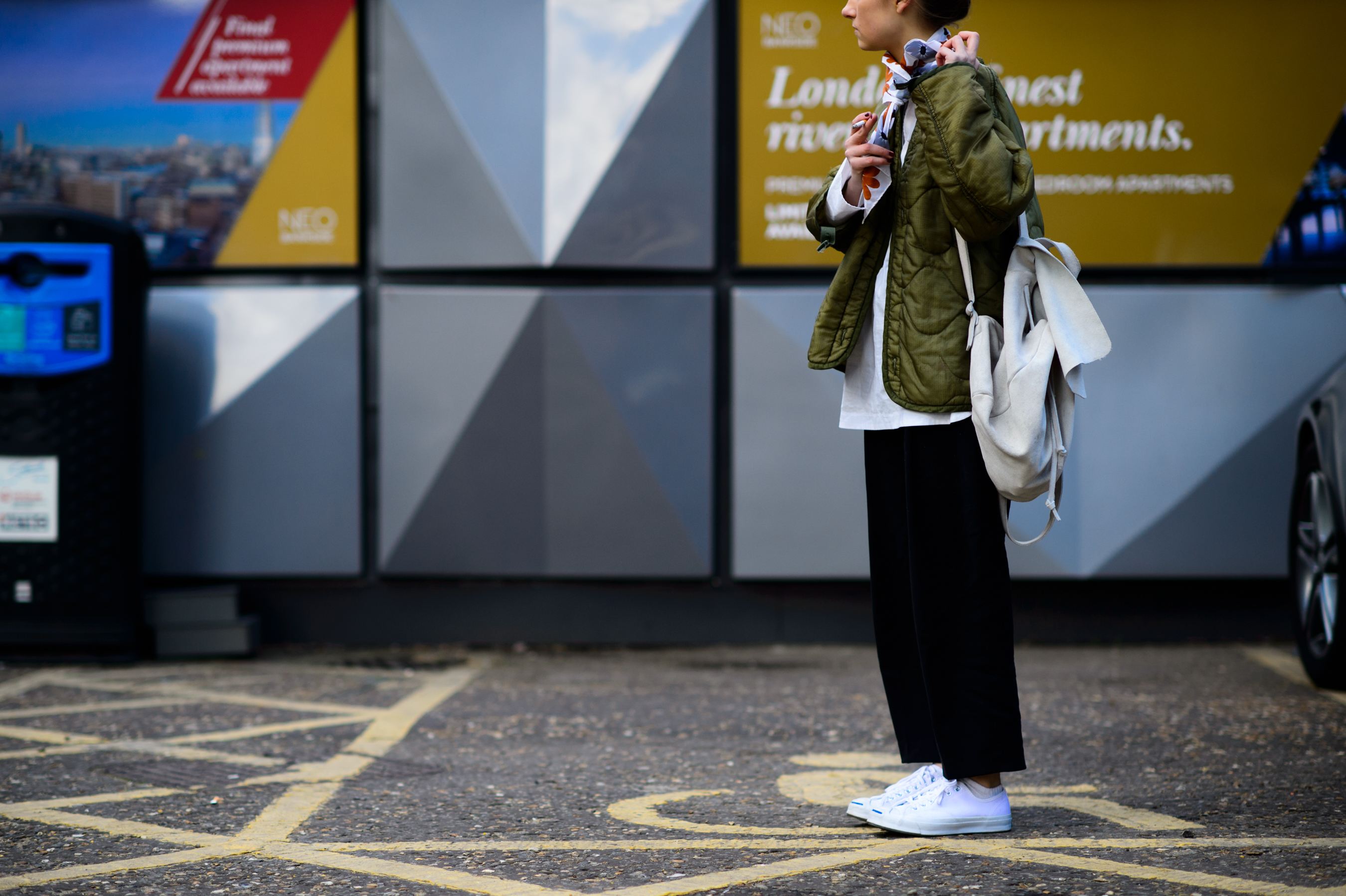 American editor wearing green jacket