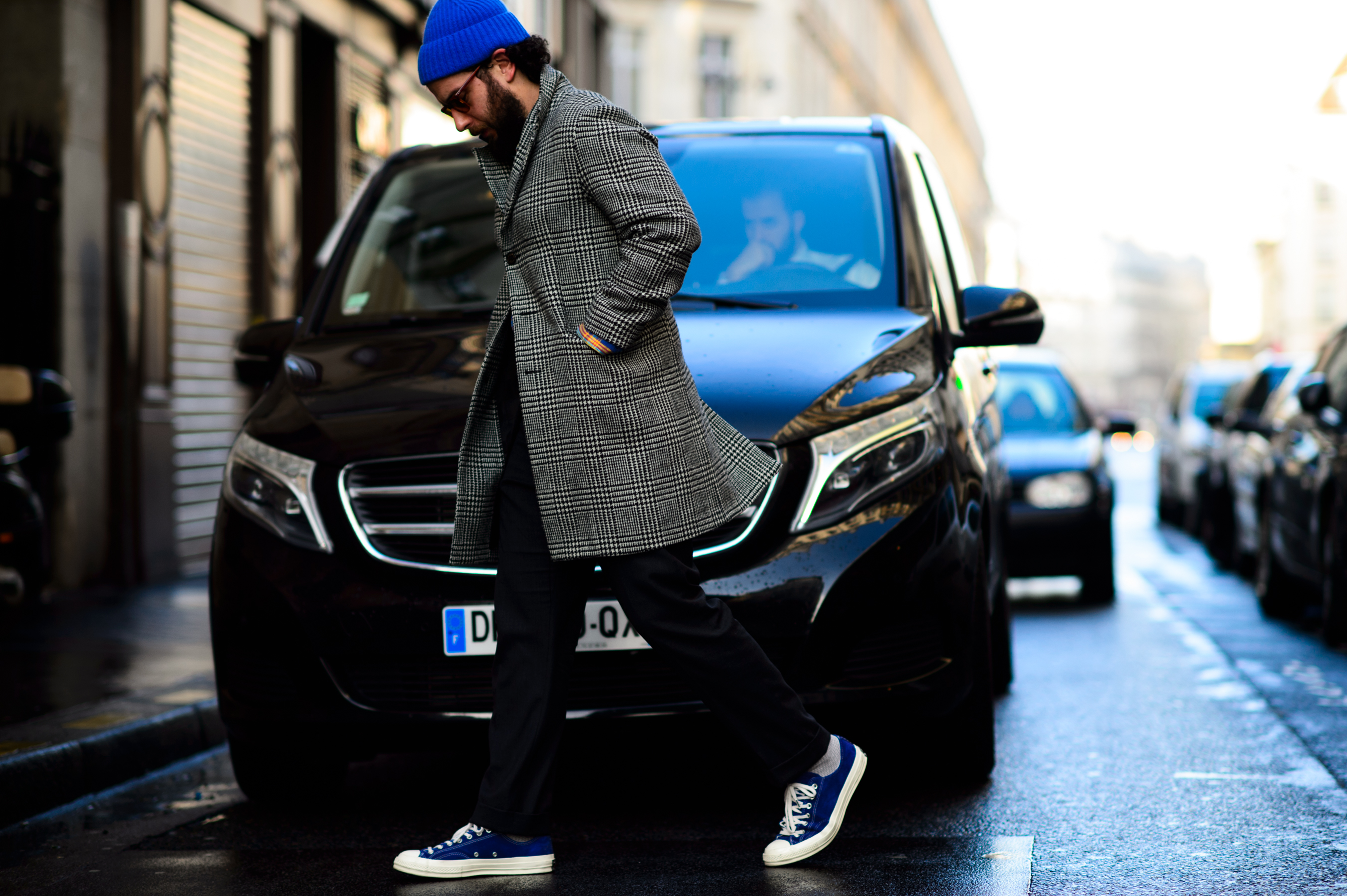 Man wearing coat and blue beanie