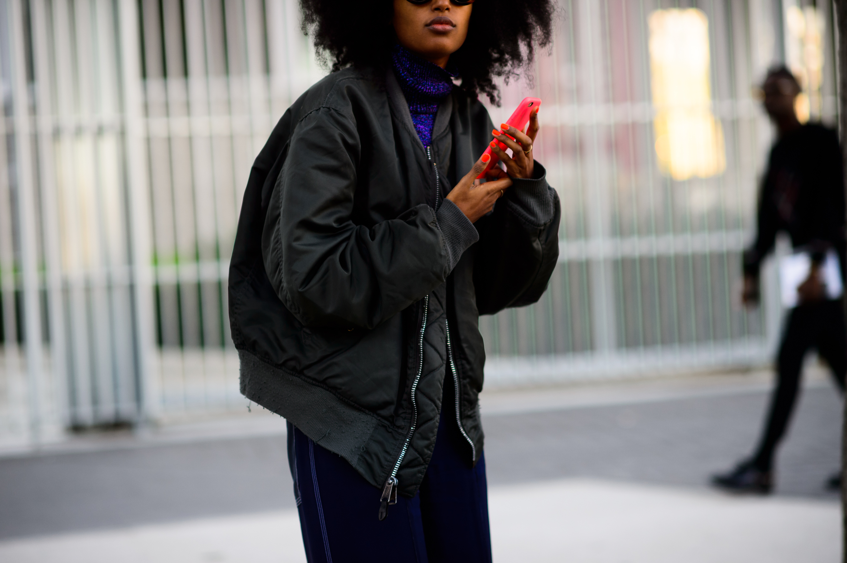 Woman wearing black bomber