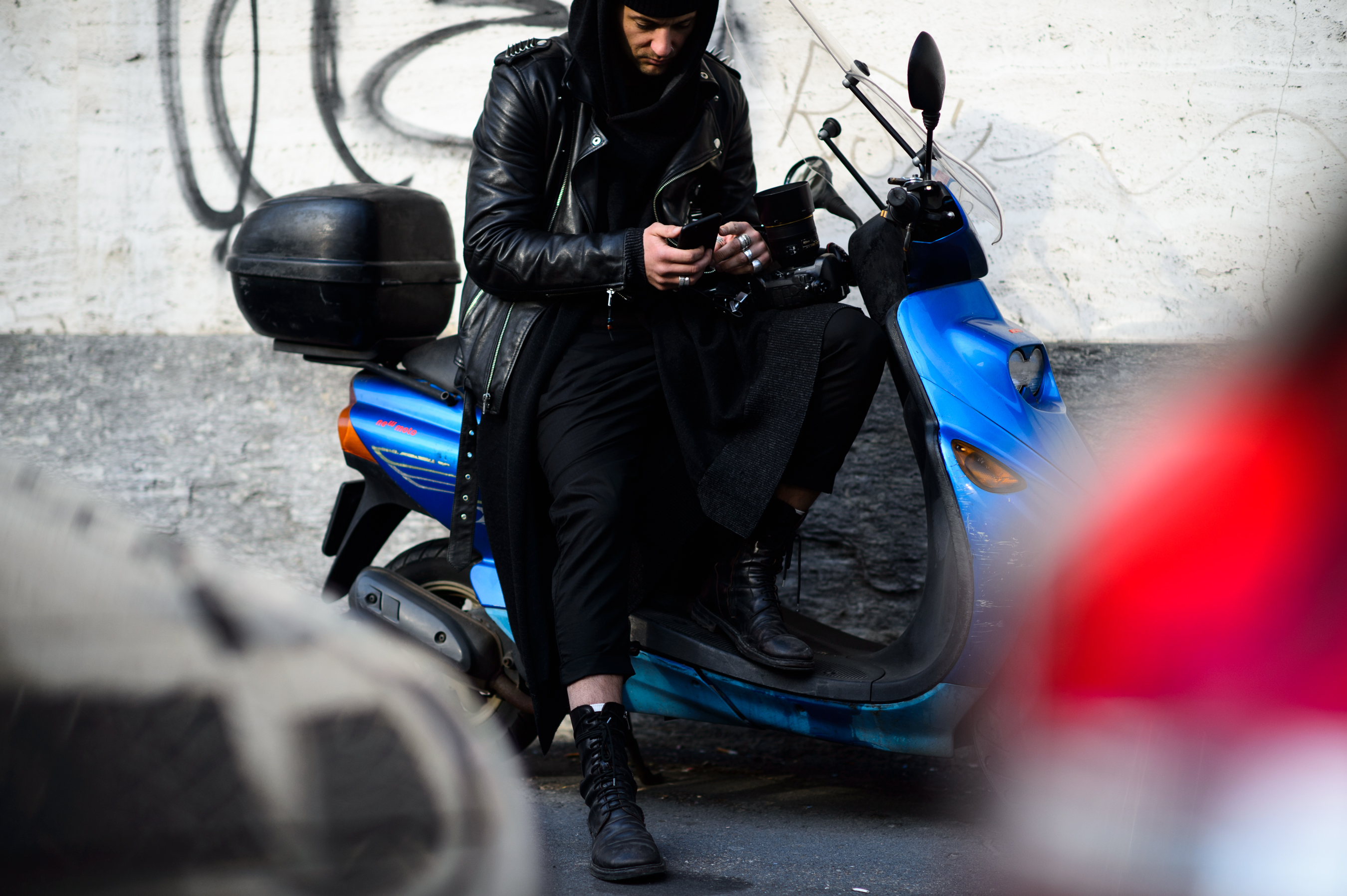 French photographer sitting on a scooter
