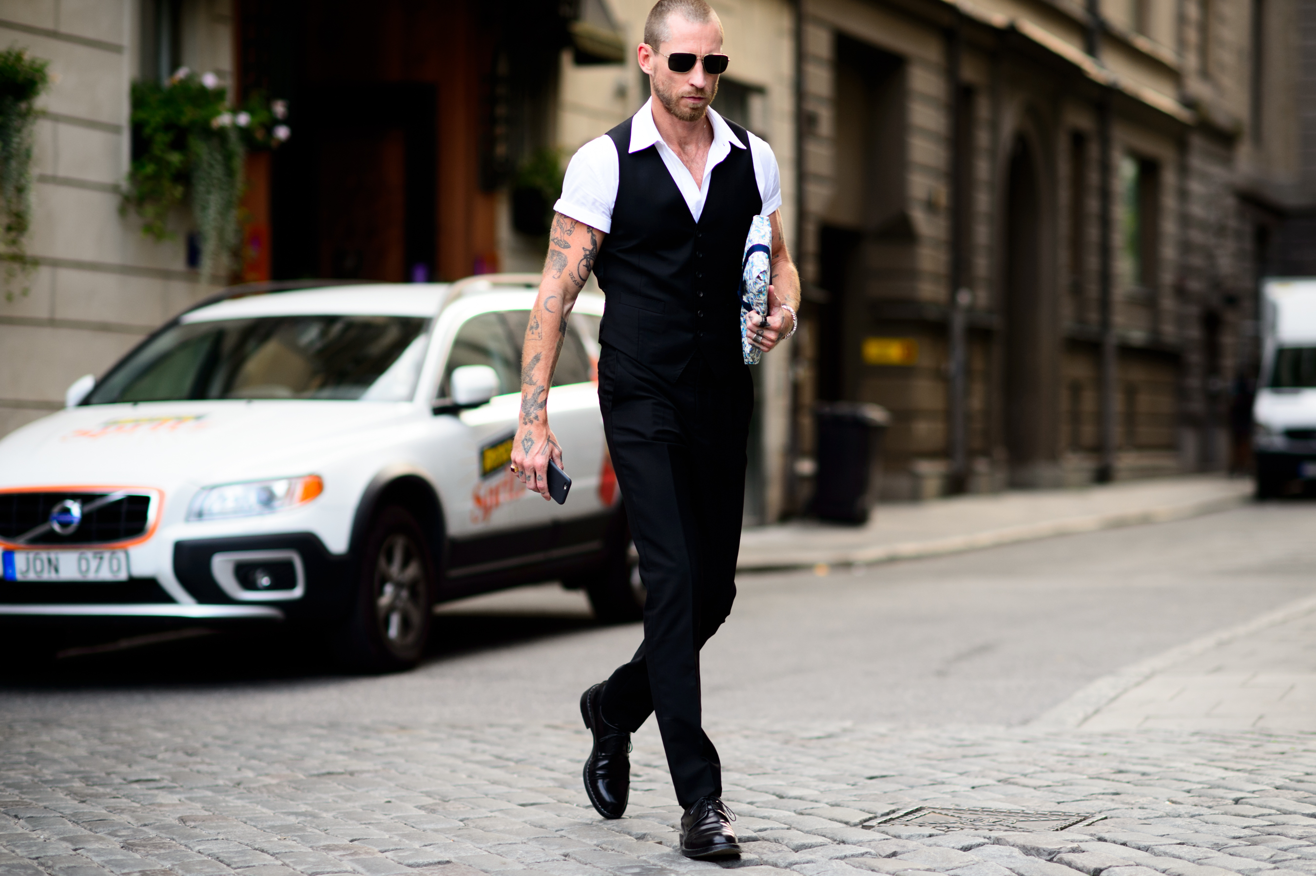 Man wearing suit and short sleeve shirt