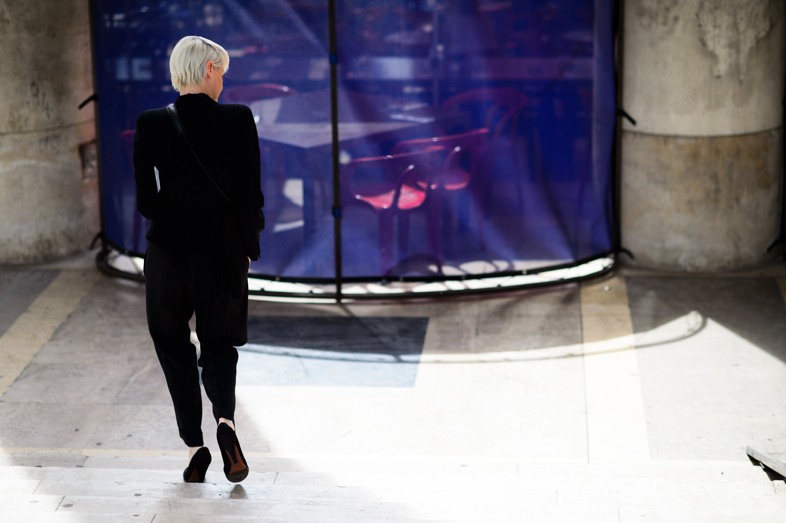 Woman with silver hair wearing black suit