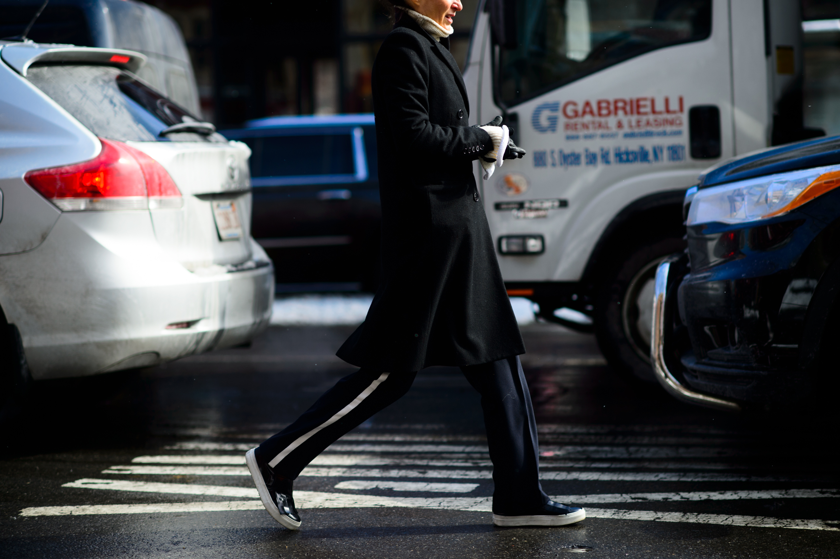 Woman wearing pants with white stripe