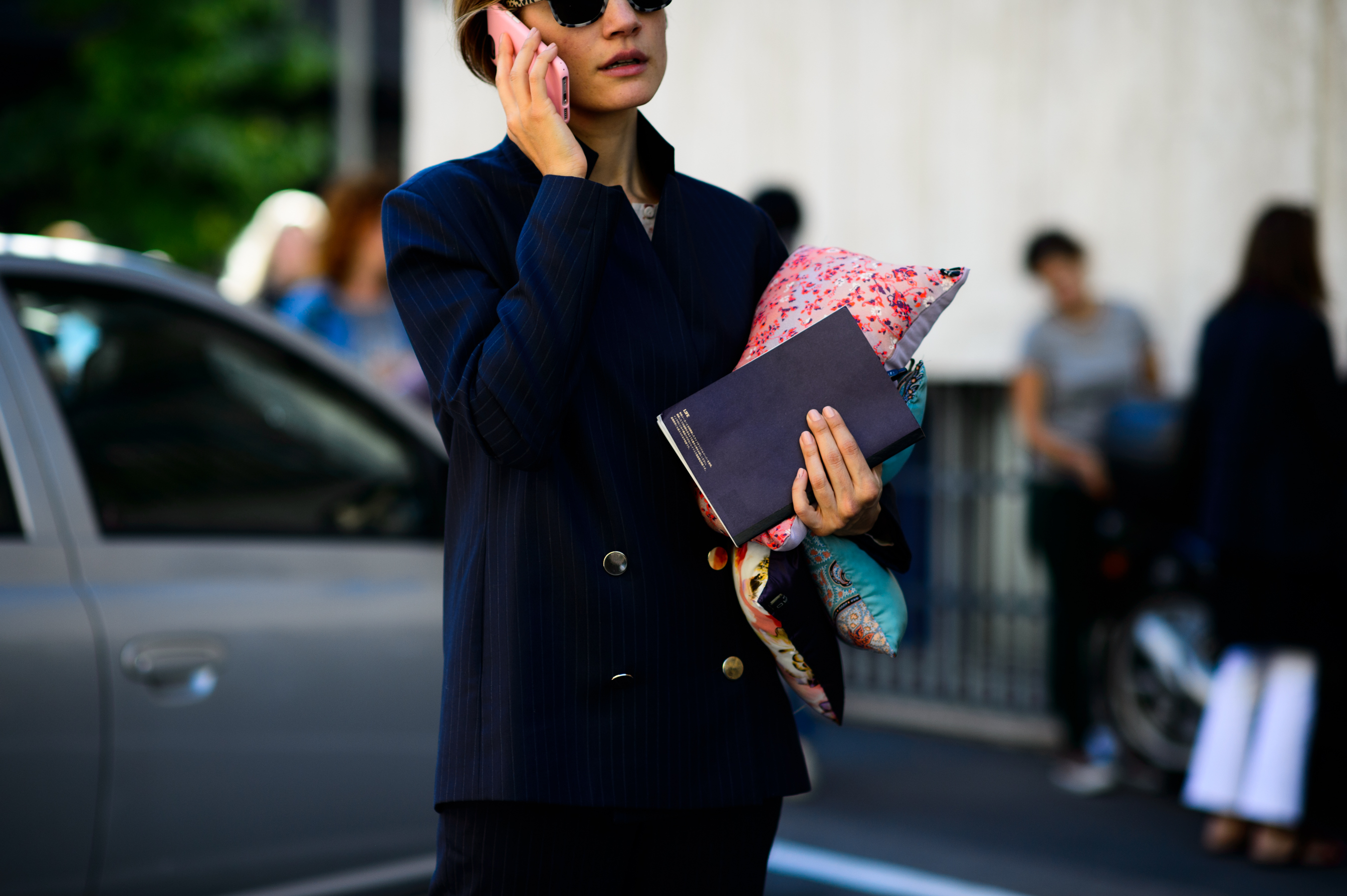Woman holding Etro pillows after the show