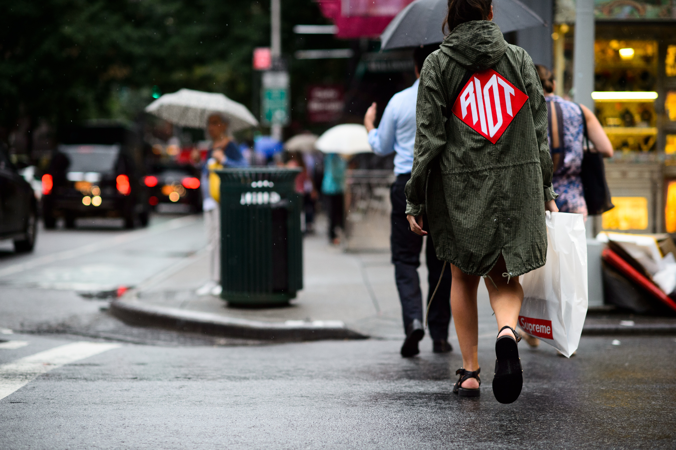 Woman wearing parka with big patch on a back