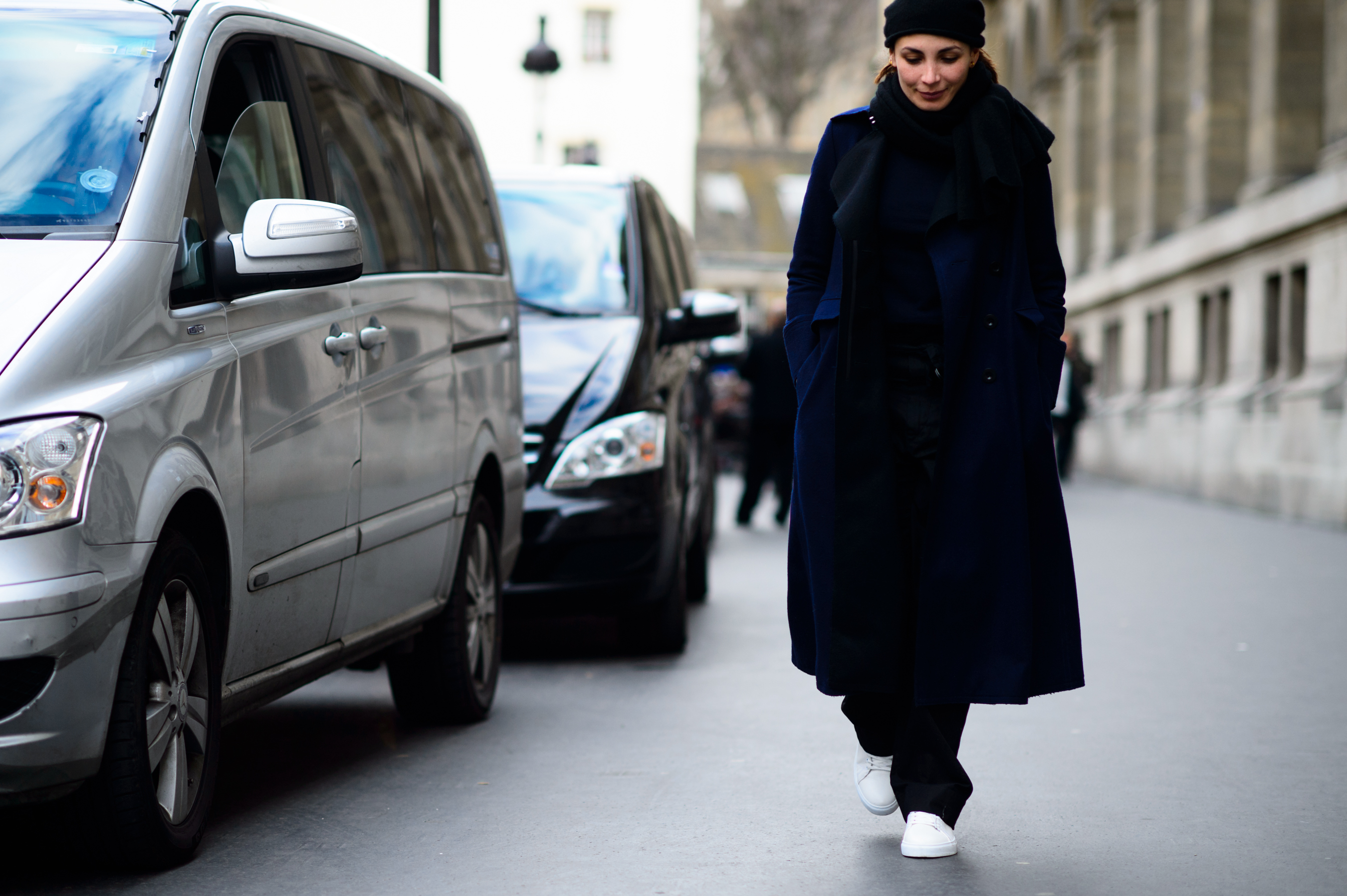 Woman wearing long blue coat