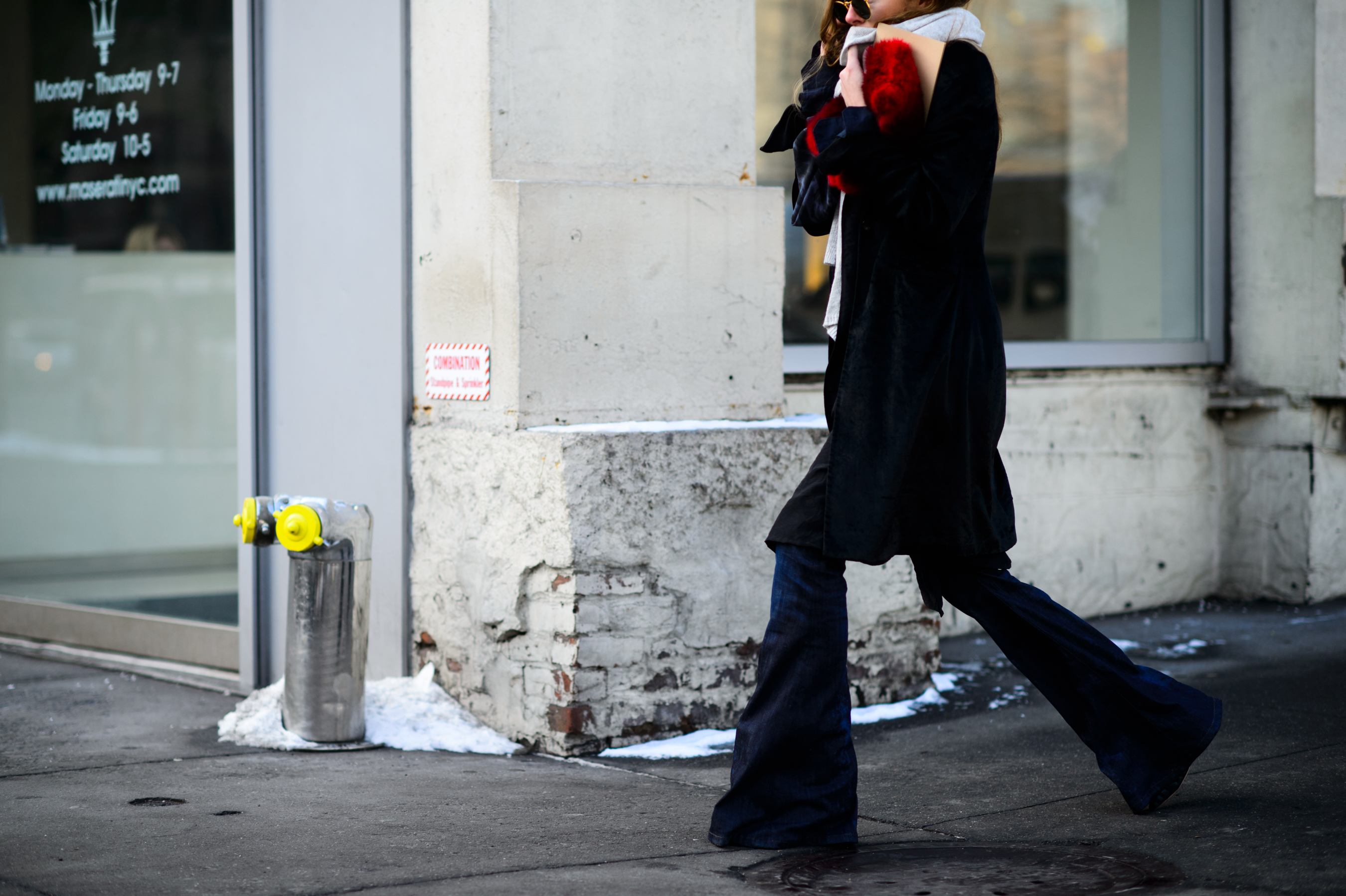 Woman holding fur clutch