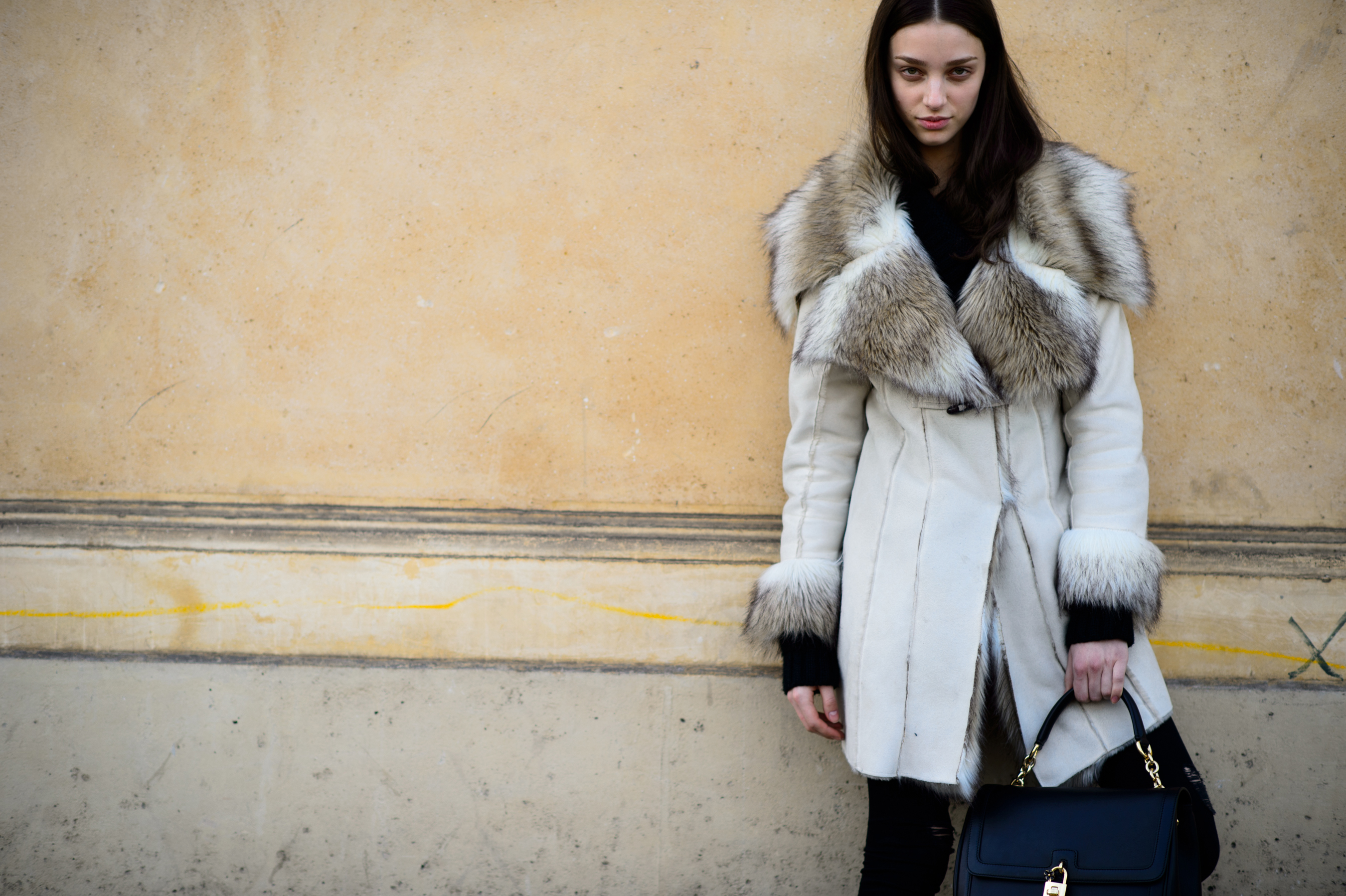 Model wearing fur coat after the show