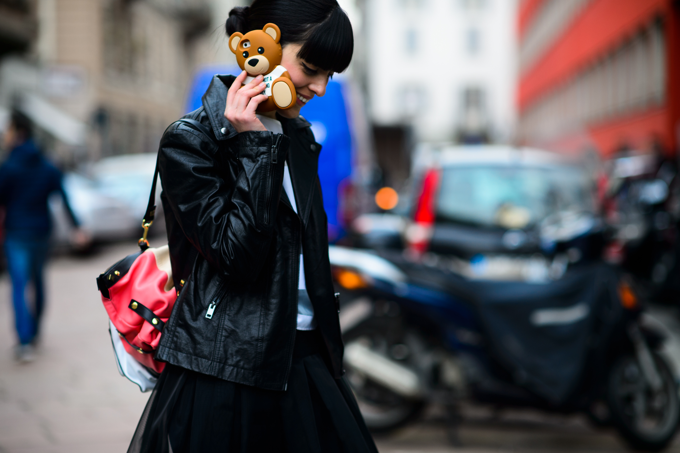 Italian blogger holding a bear shaped phone case