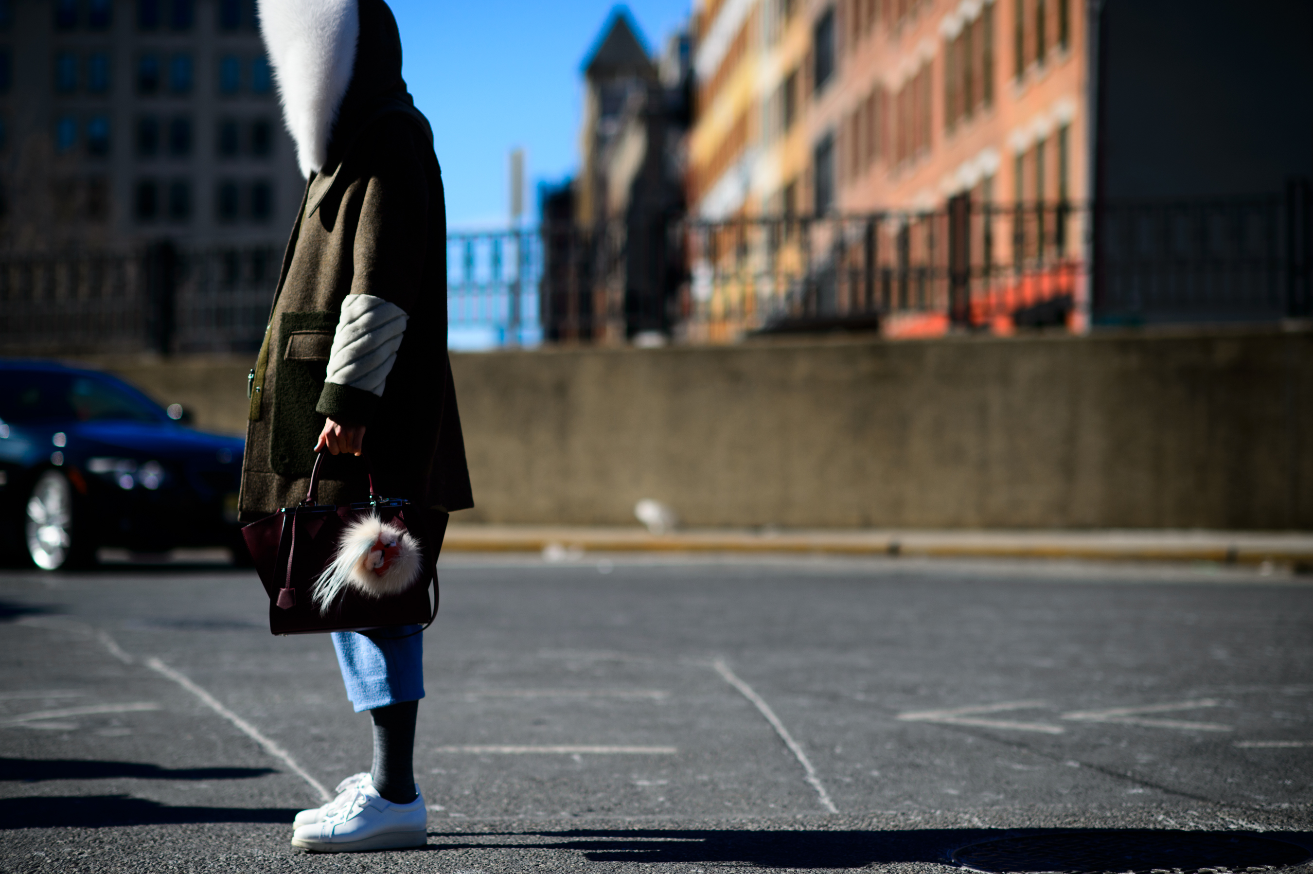 Blogger wearing jacket with furry hood