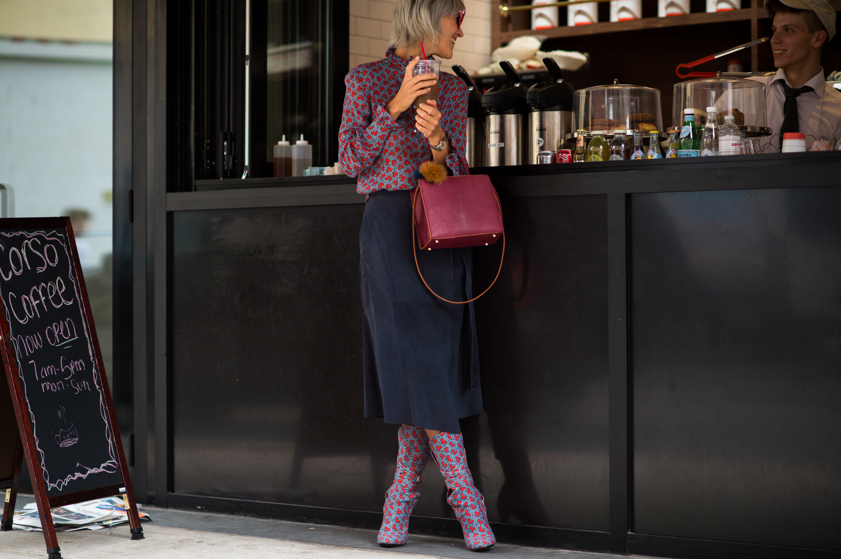 Blogger with short hair at the bar