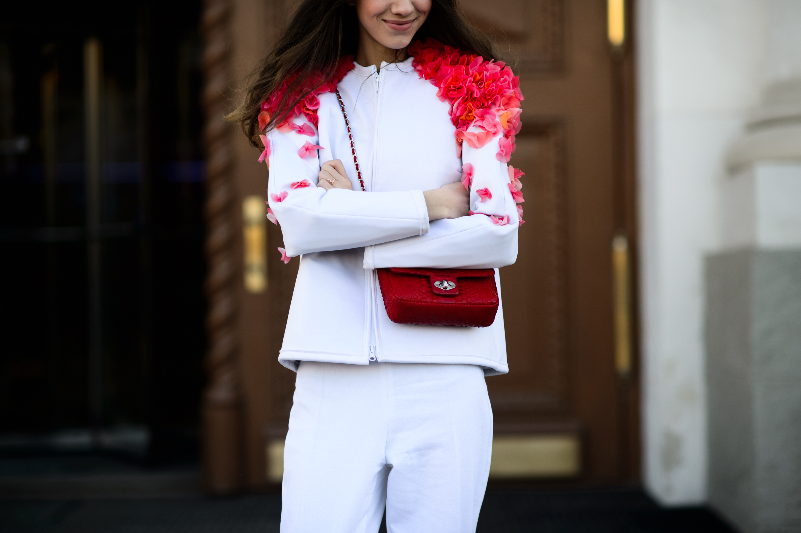Russian blogger wearing white suit