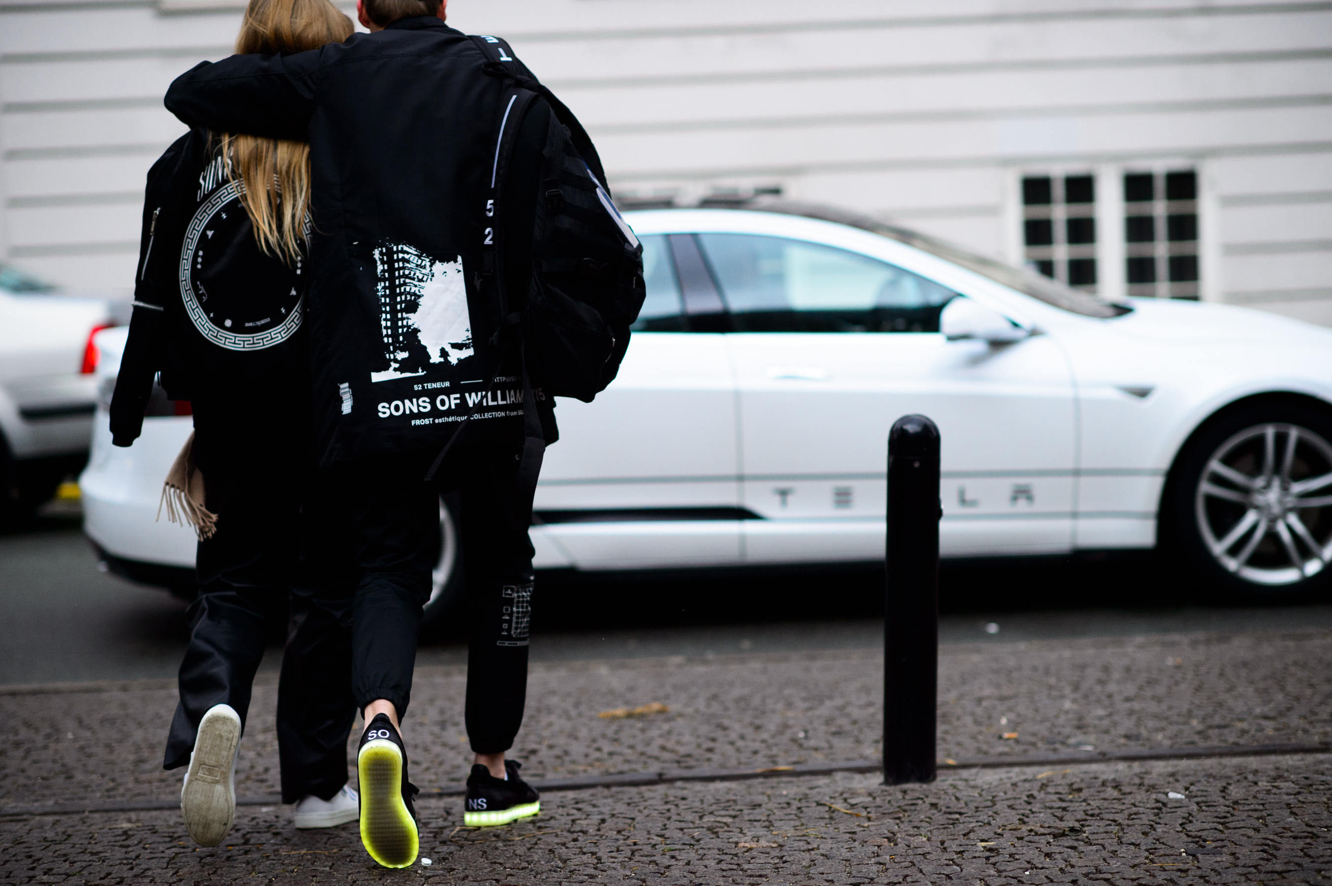 Model and her friend crossing the road