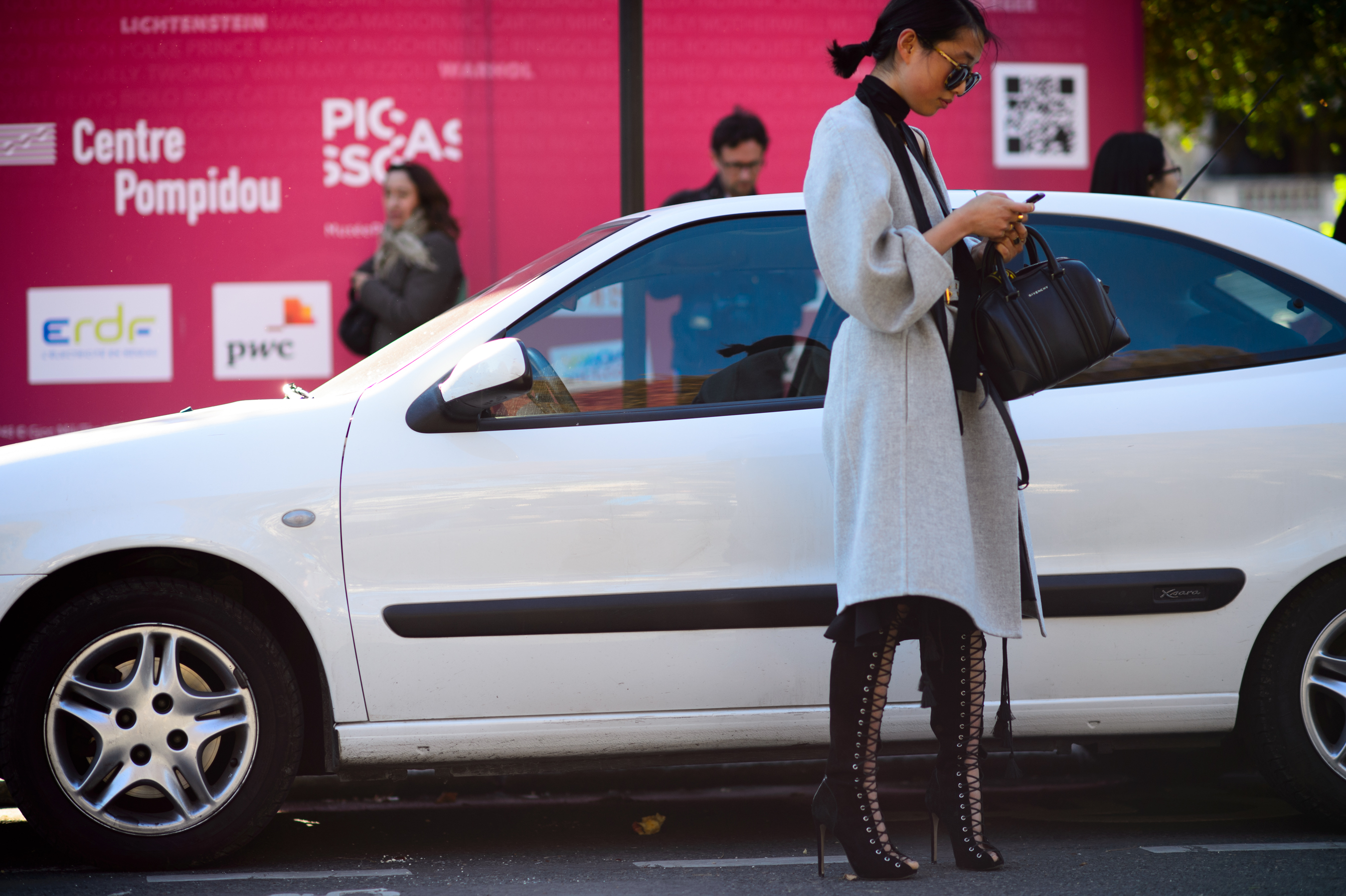 Australian photographer and blogger wearing gray coat
